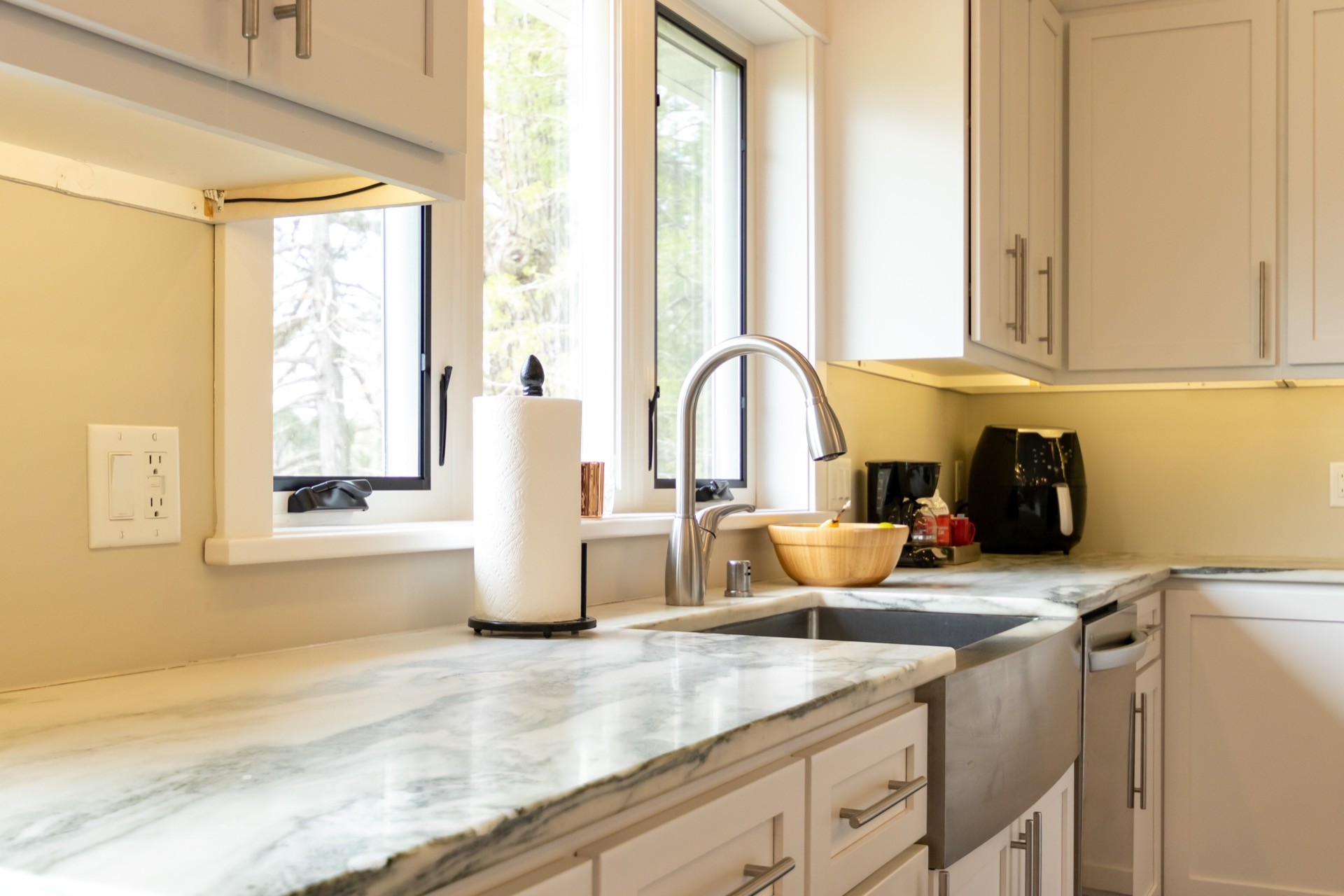 three men sitting on chair beside tables