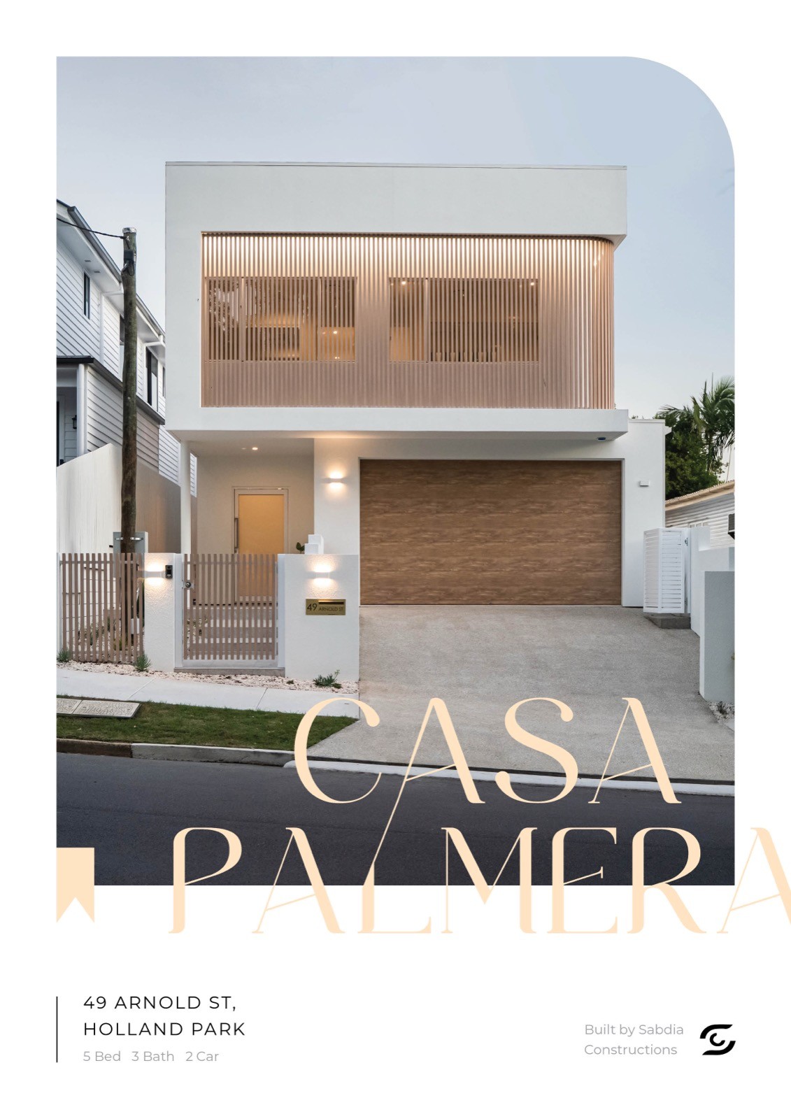 Casa Palmera property magazine cover spread, with the Casa Palmera wordmark over a photograph of the home, address and builder credit