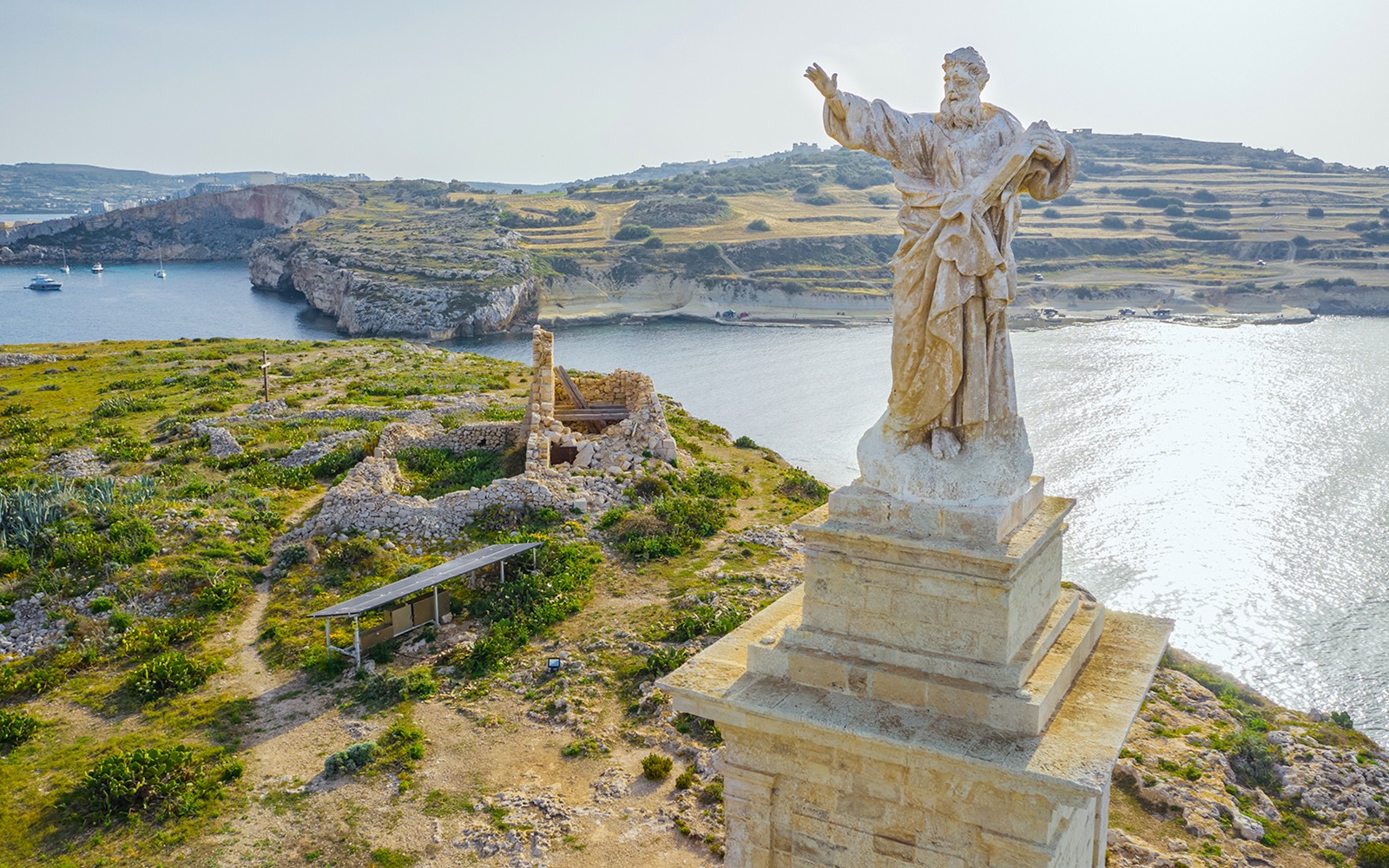 Aerial view of St. Paul's statue overlooking St. Paul's Island, Malta.