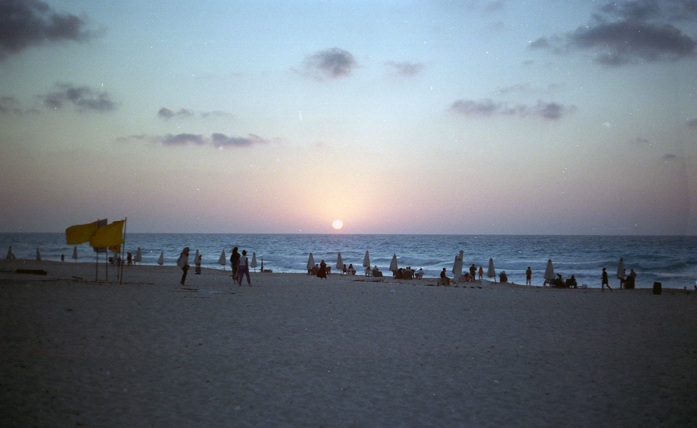 Beachgoers at Sunset