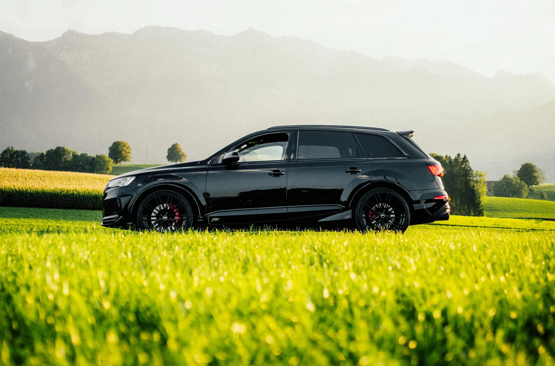 Car rental website header image showing a vehicle in a scenic outdoor setting.