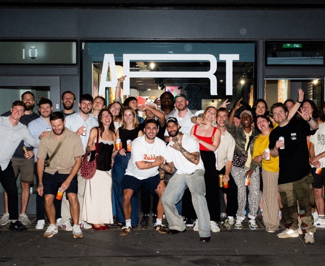 Woman wears a blue coat in a blue environment.