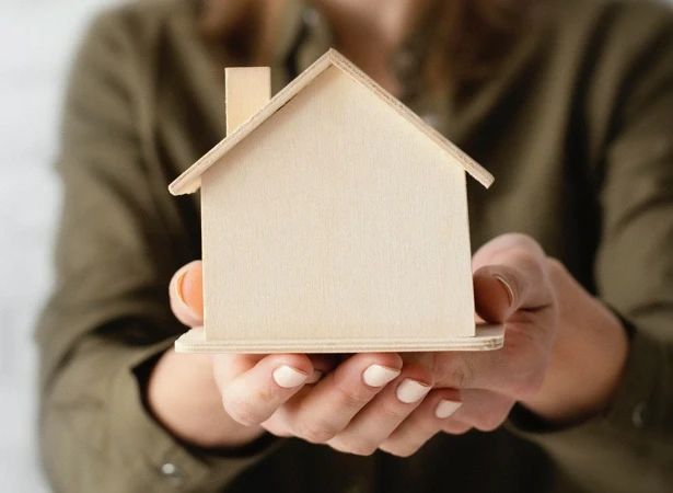 holding a wooden house secure insurance