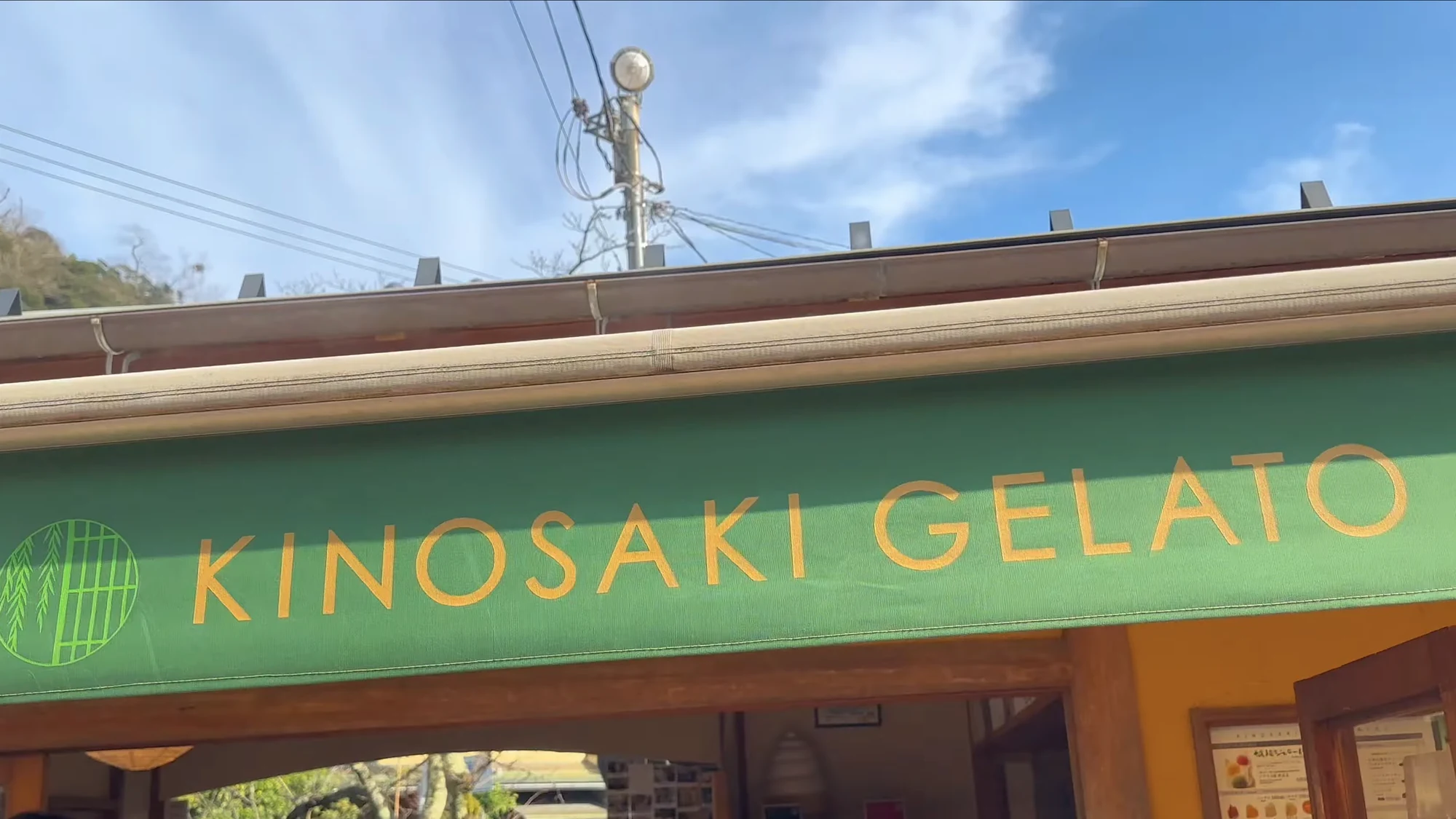 A gelato shopfront in Kinosaki with an English sign facing the street.