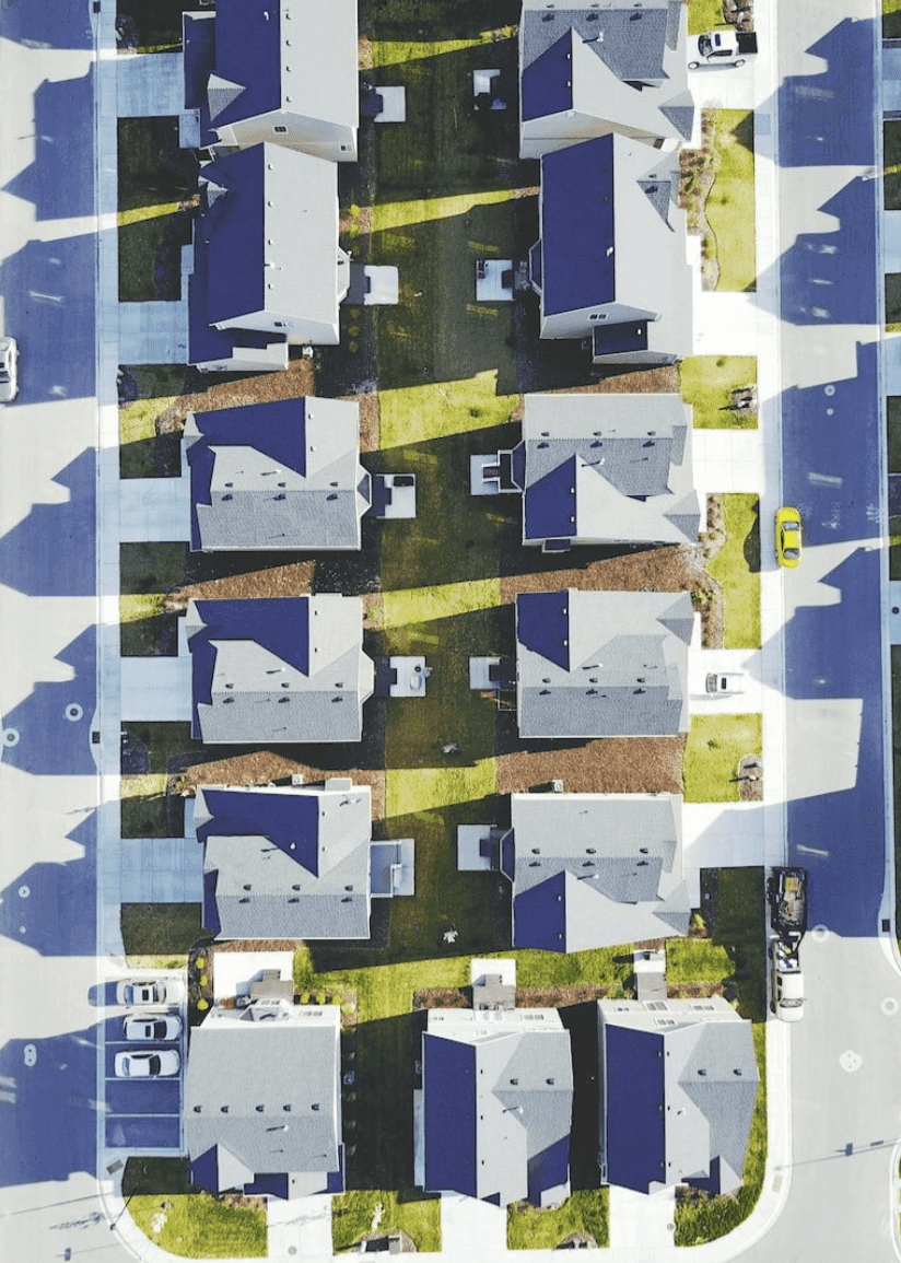 Rows of suburban houses seen from above.