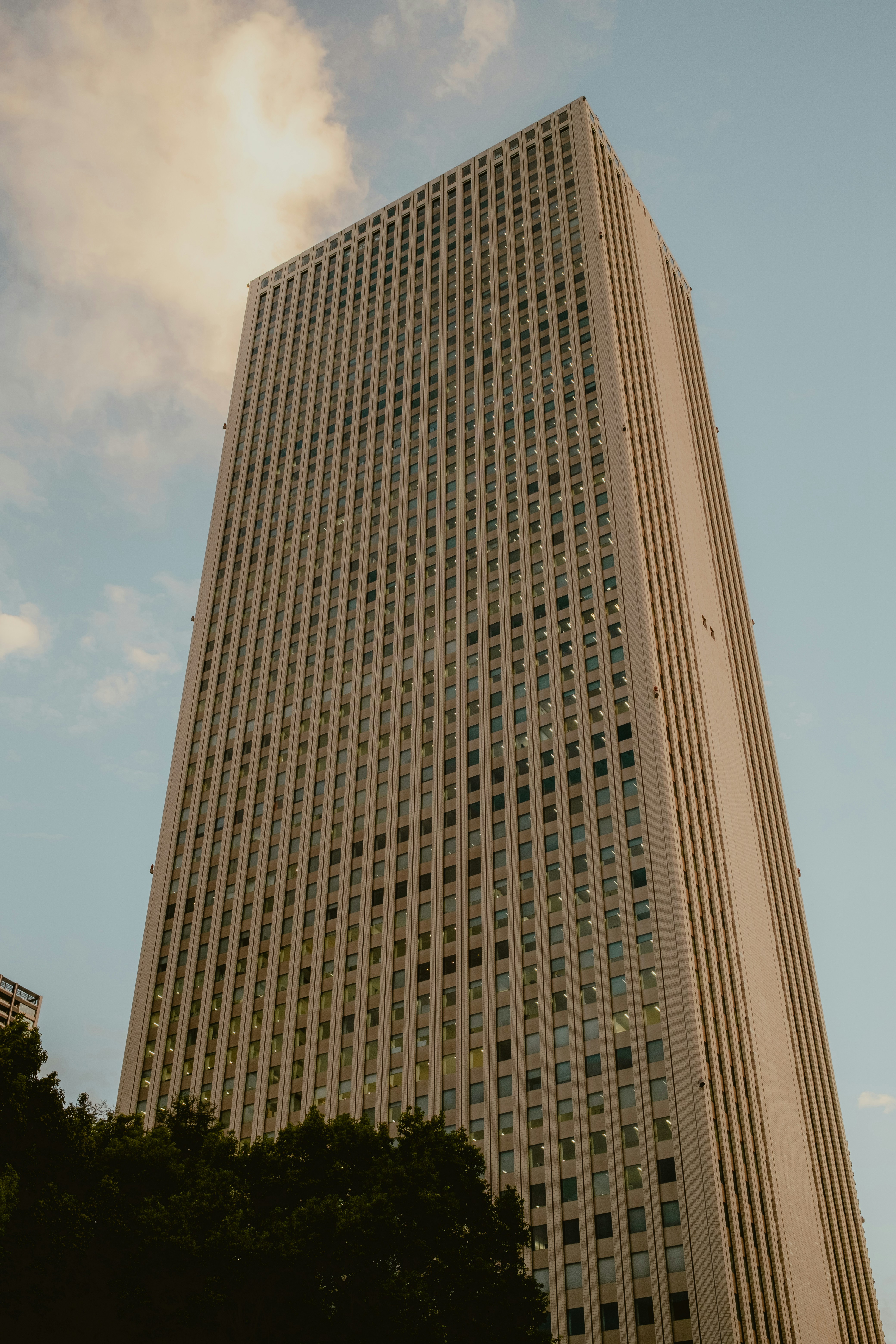 Tall skyscraper rises into the sky.