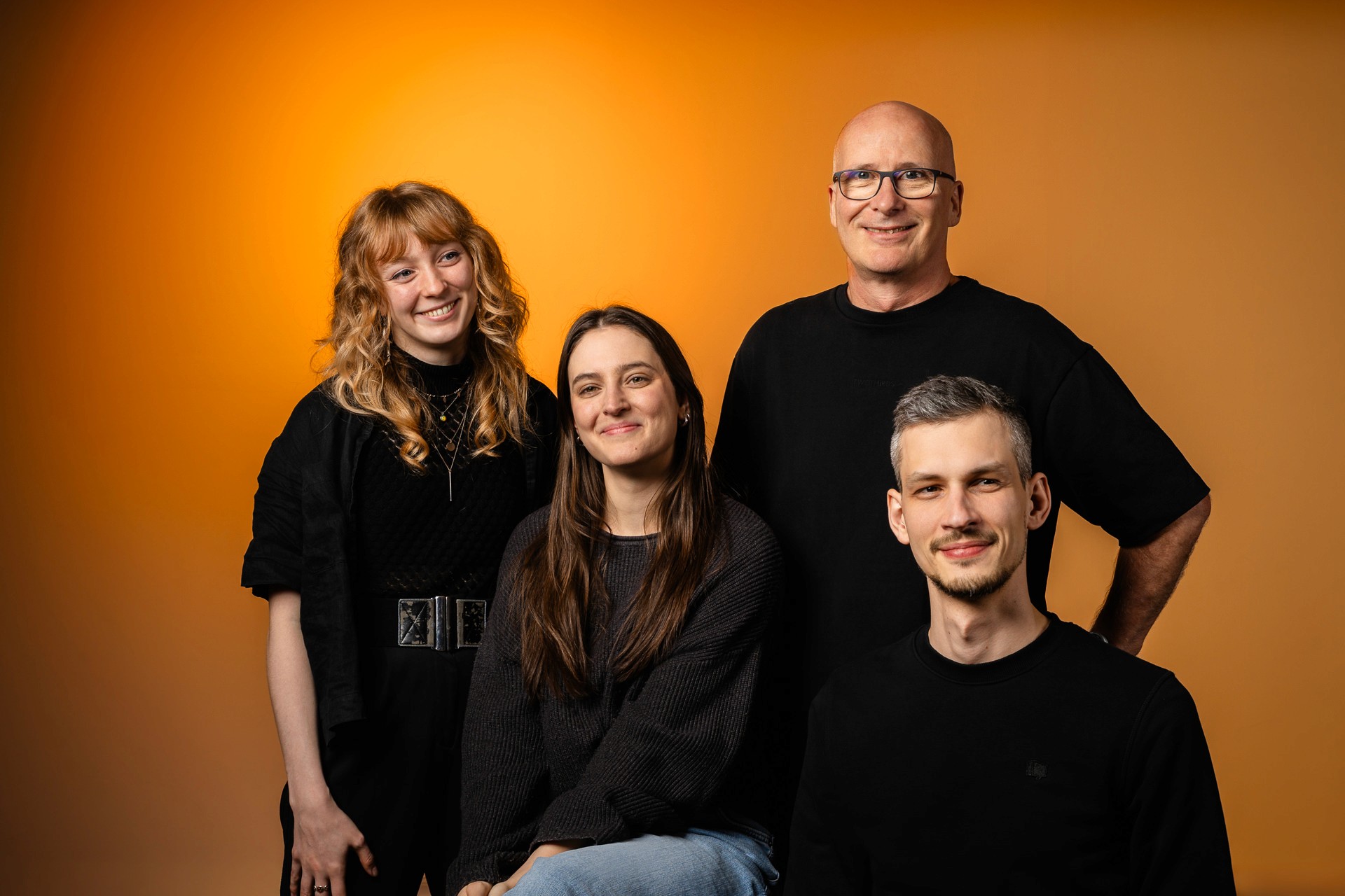 people sitting on chair in front of laptop computers