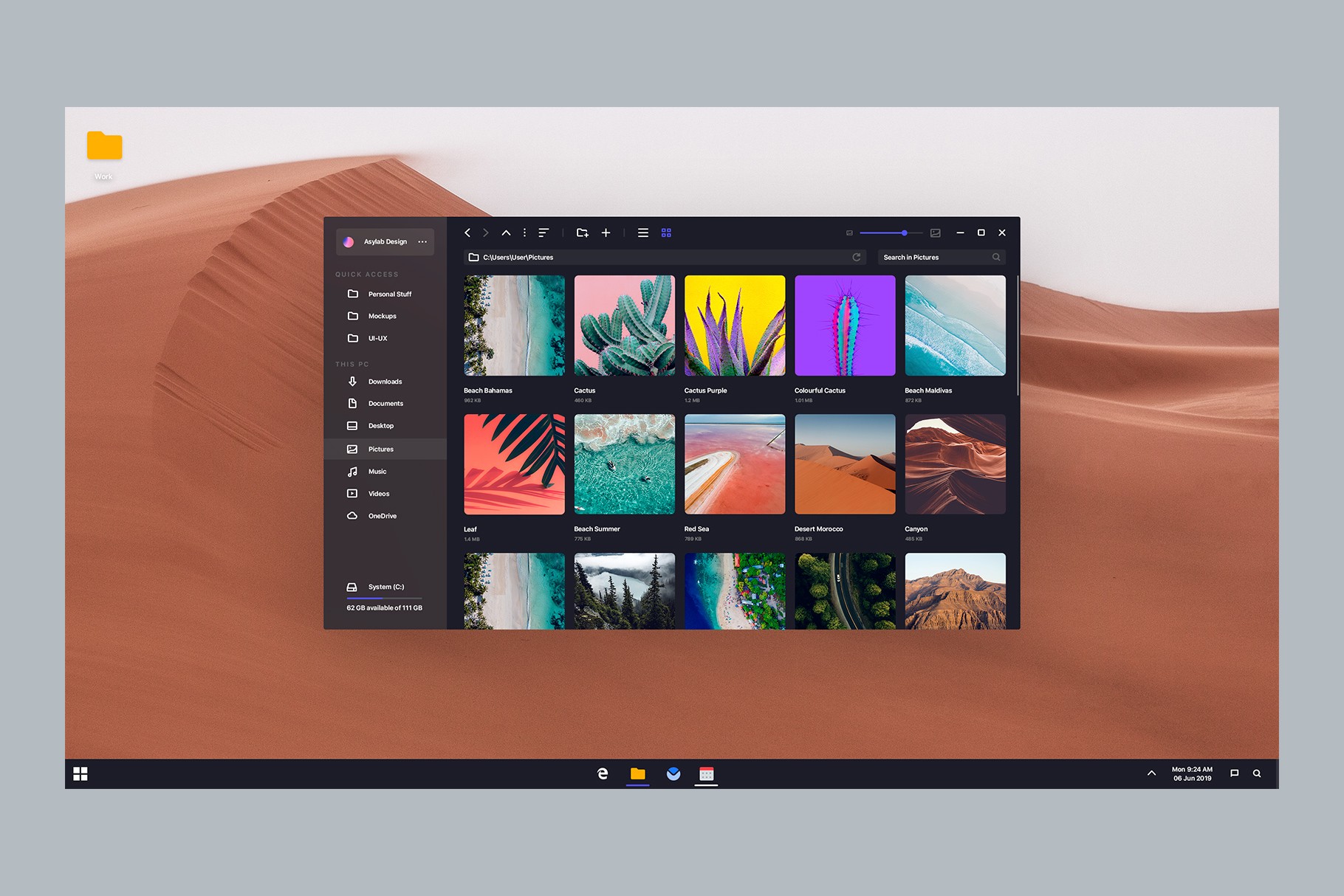 Dark mode Windows 11 concept with a desert wallpaper and open image gallery.