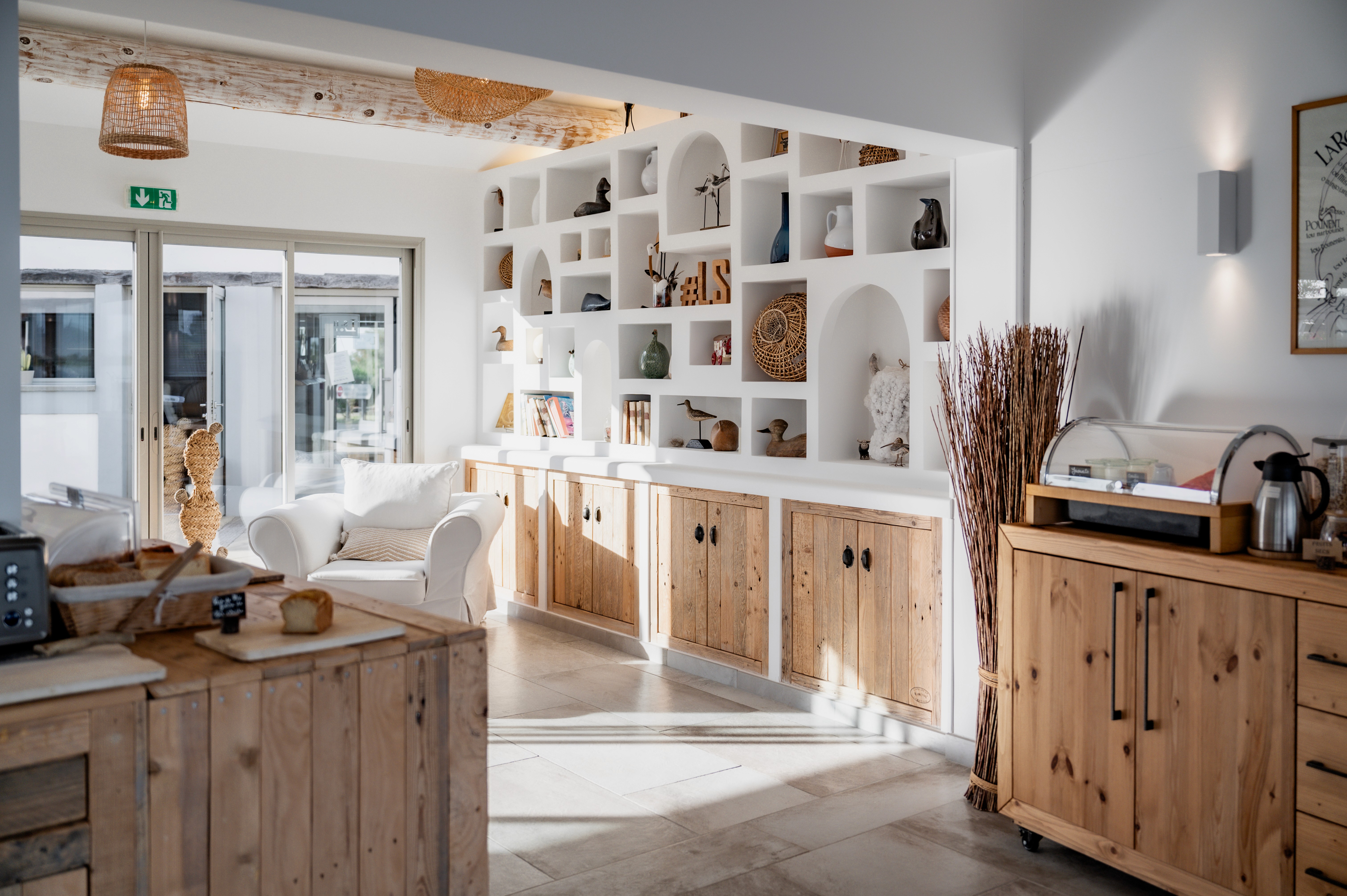 white bed linen with throw pillows
