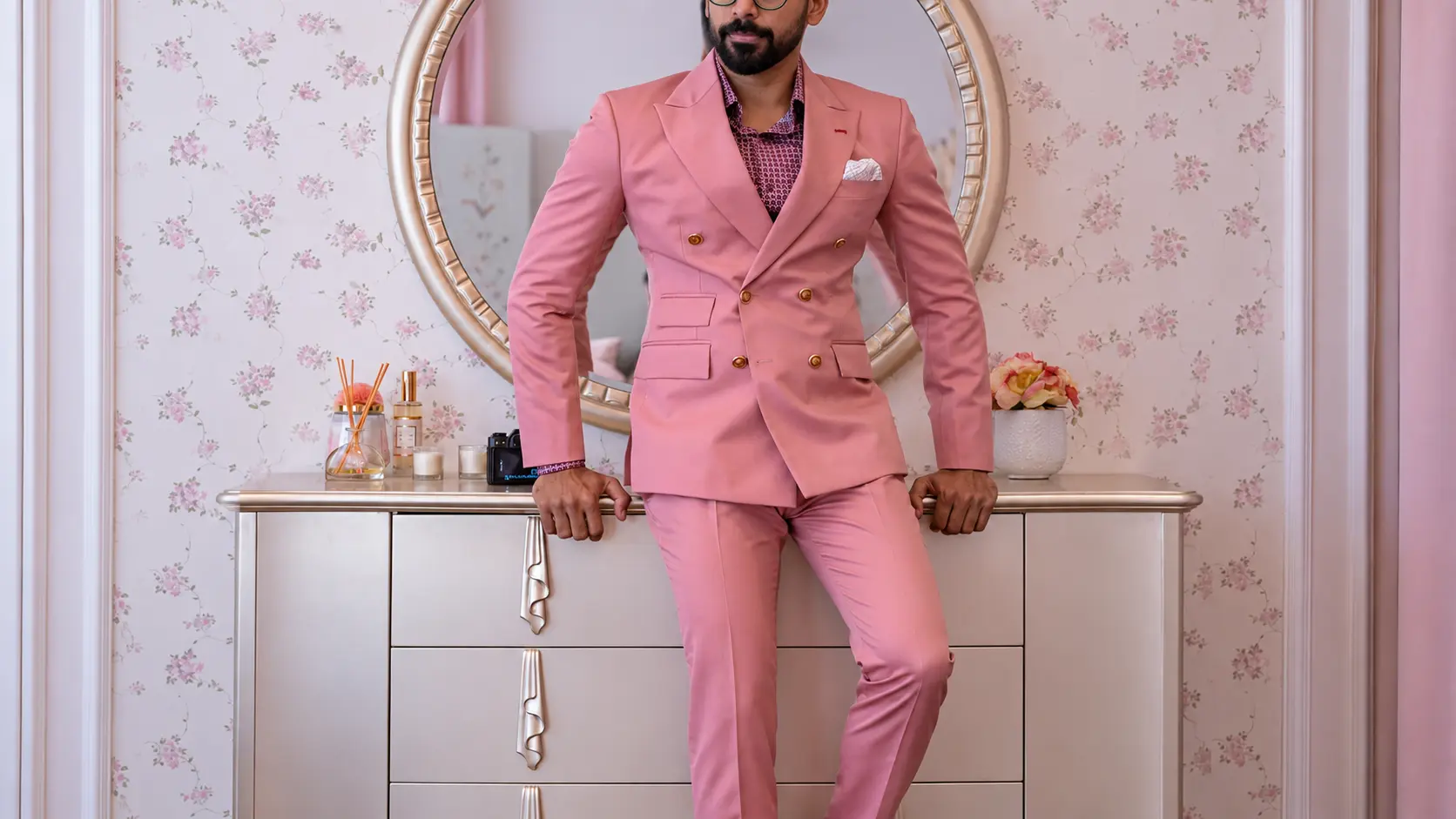 A man styling in pink custom suit in Dubai