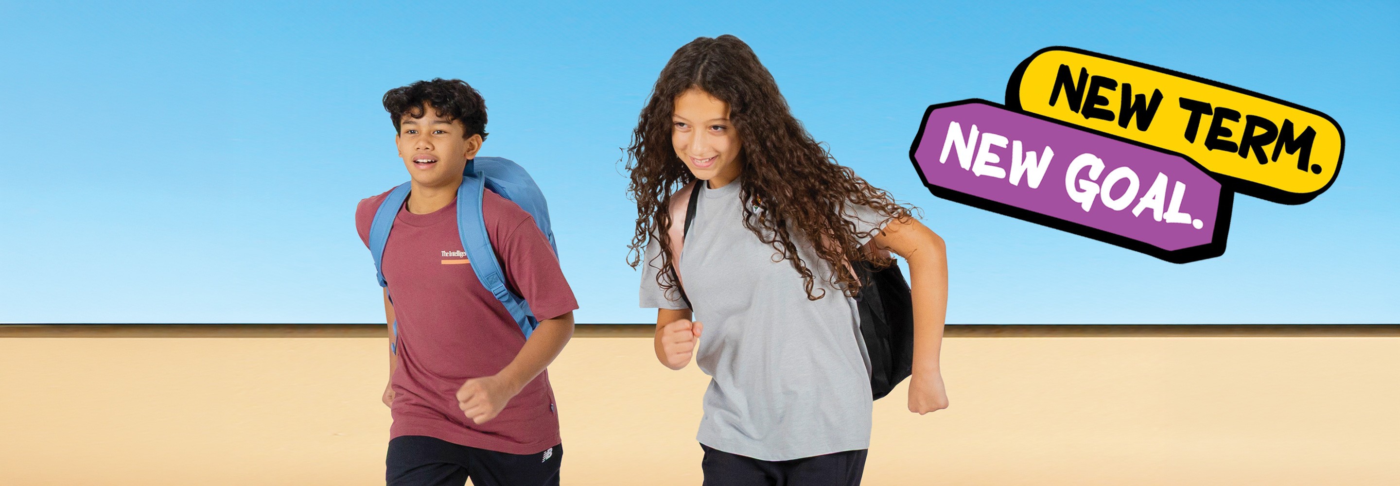 The 2025 "New Term, New Goal" key visual: two students running with backpacks against a blue sky, the headline set in playful speech bubbles.