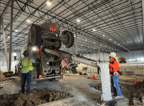 QBS Construction site team inside large-scale industrial warehouse facility
