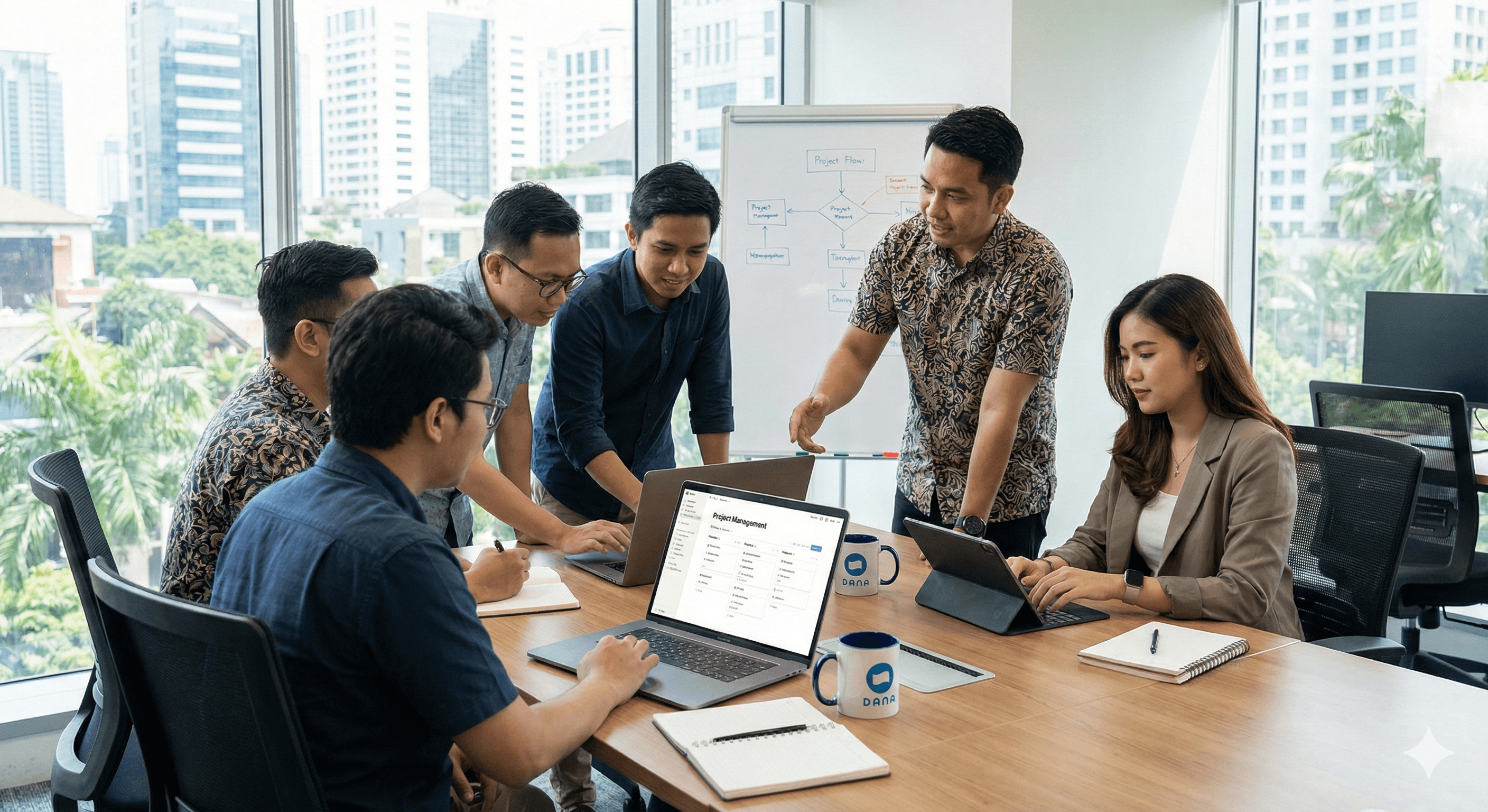 A group of professionals engaged in a collaborative meeting around a conference table with laptops and documents, set against the backdrop of a modern office space with large windows offering a view of a cityscape; relevant to topics on teamwork and business in Indonesia.