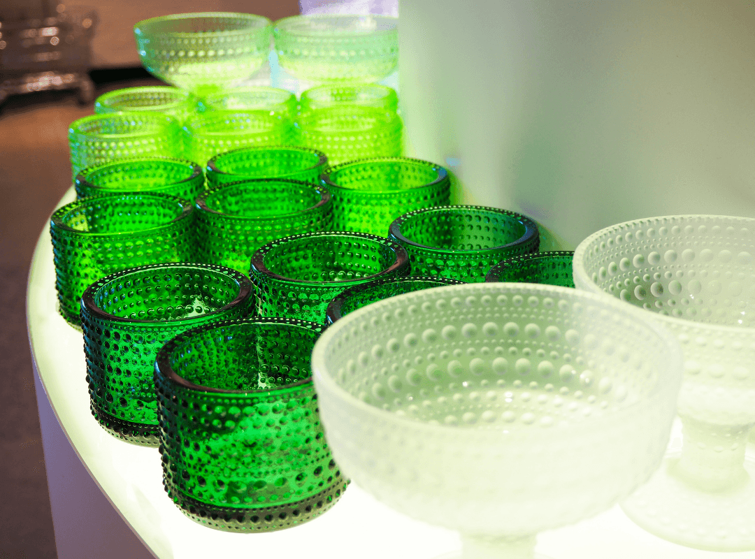 Green and white glasses with dimpled designs.