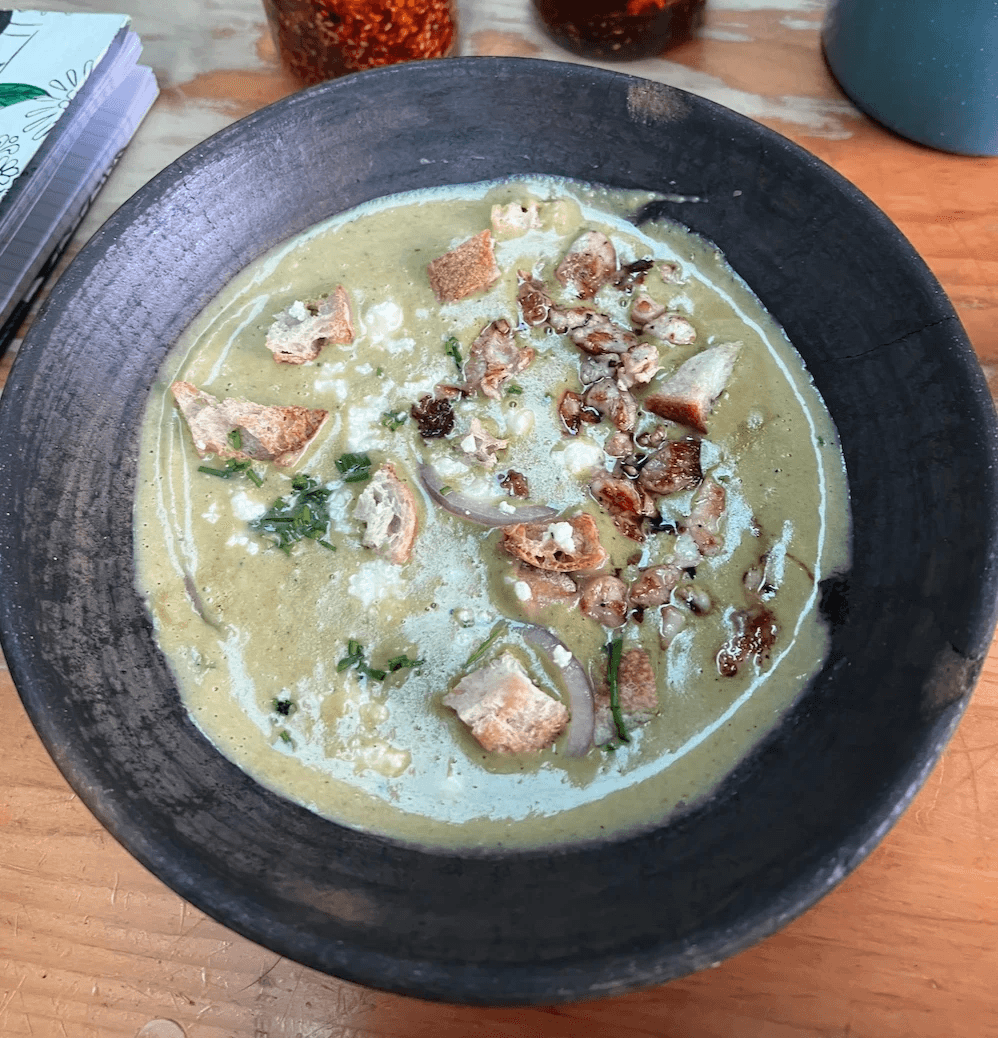  A bowl of pale green poblano soup