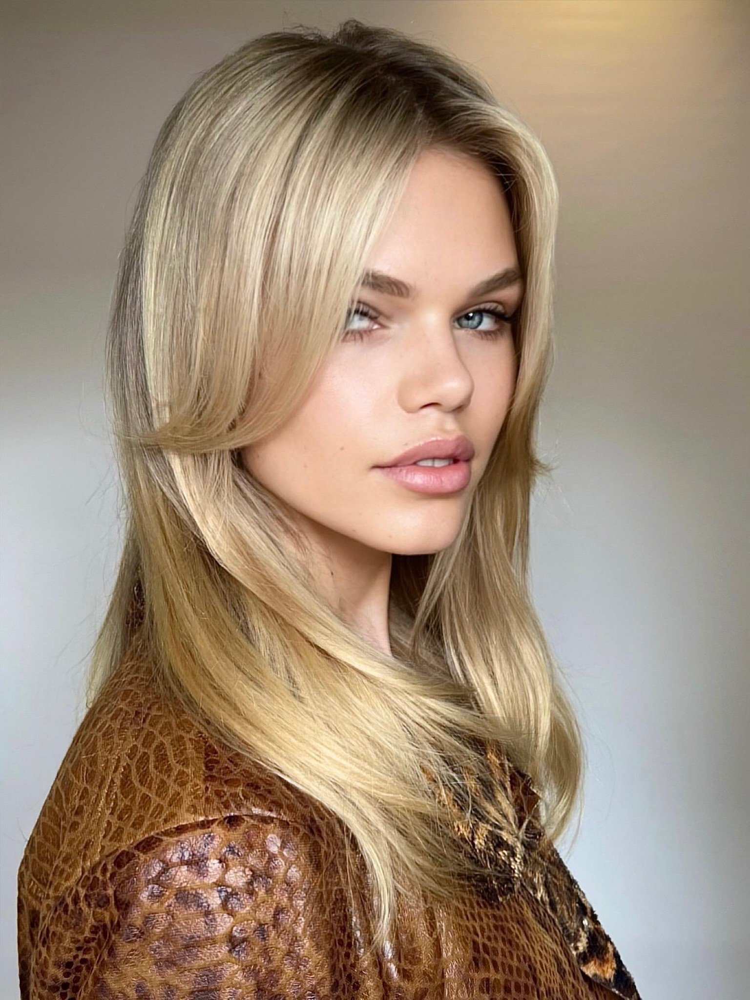 Natural champagne blonde at Bomane Salon, Beverly Hills – soft blonde with blended, healthy tones.