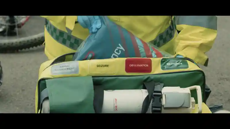 Group of presenters speaking on camera during a Microsoft live broadcast, filmed against branded event graphics.