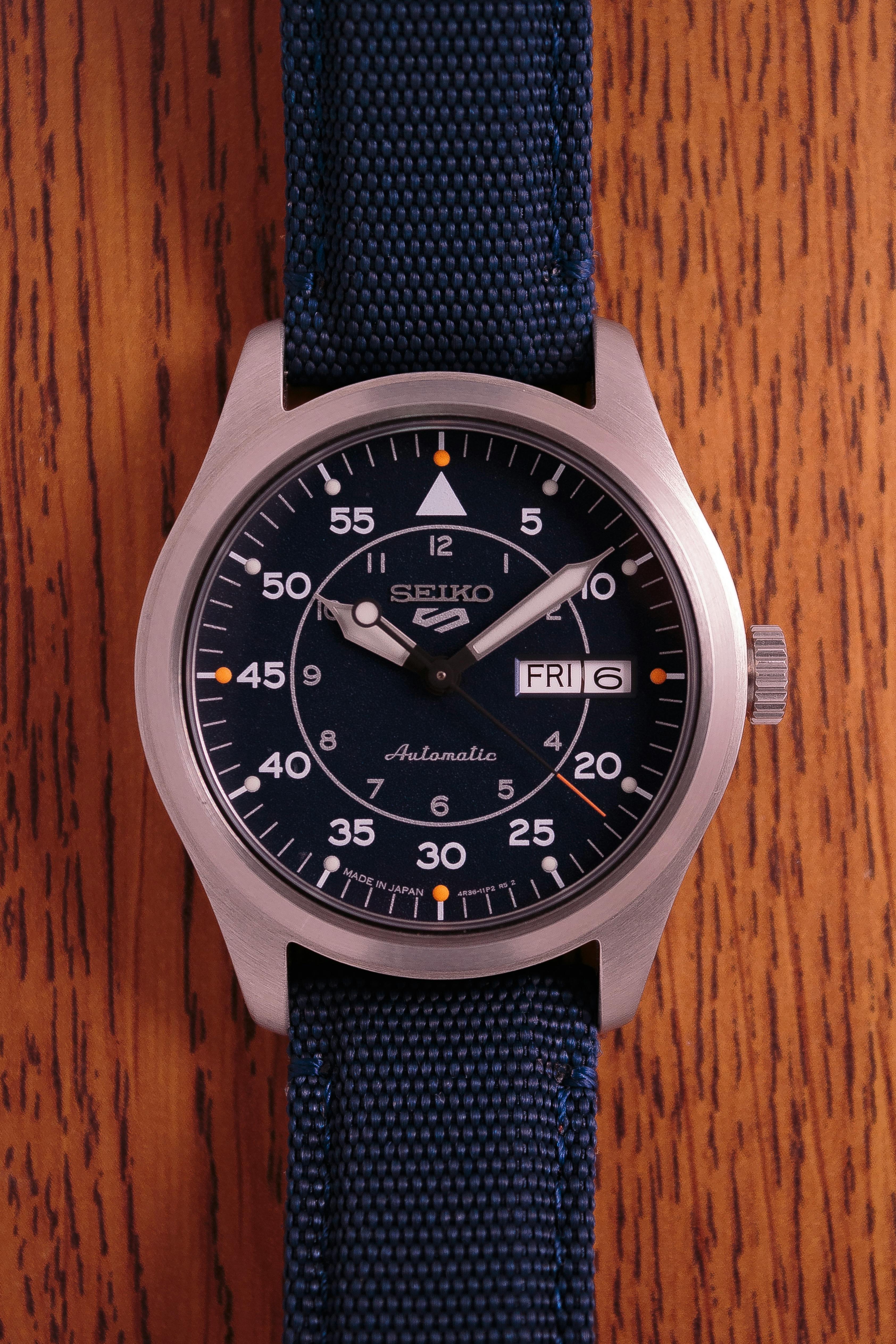 Seiko 5 automatic watch showing the grey watch dial and date function