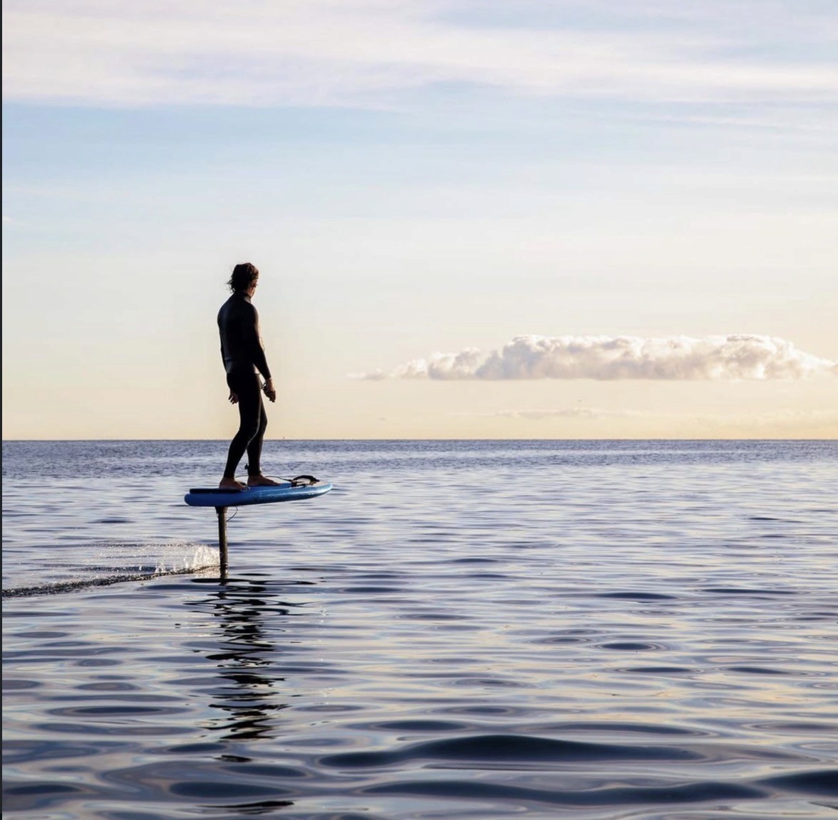 Man with surfing with paddle