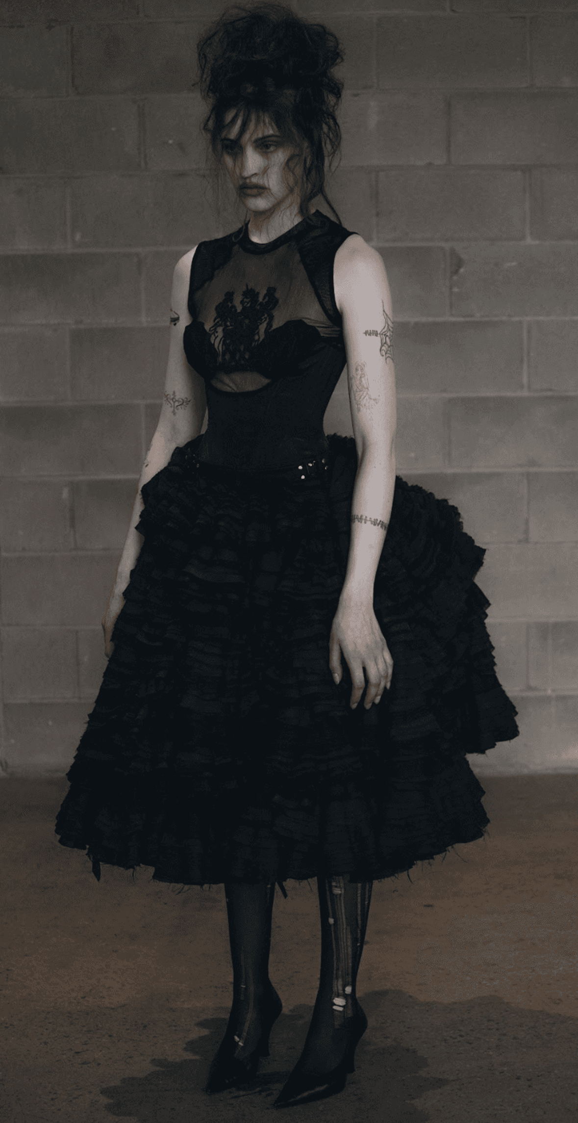 Model wearing a black dress