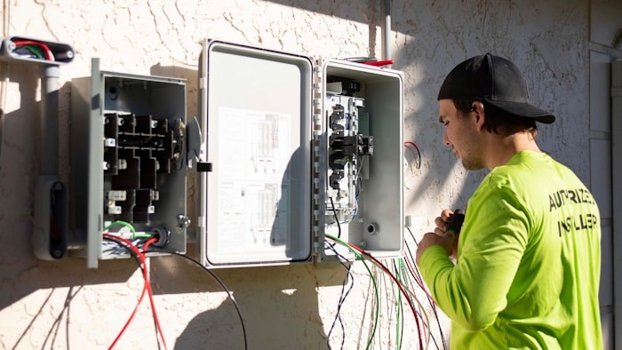 Reviewing energy usage data on a laptop during a site assessment
