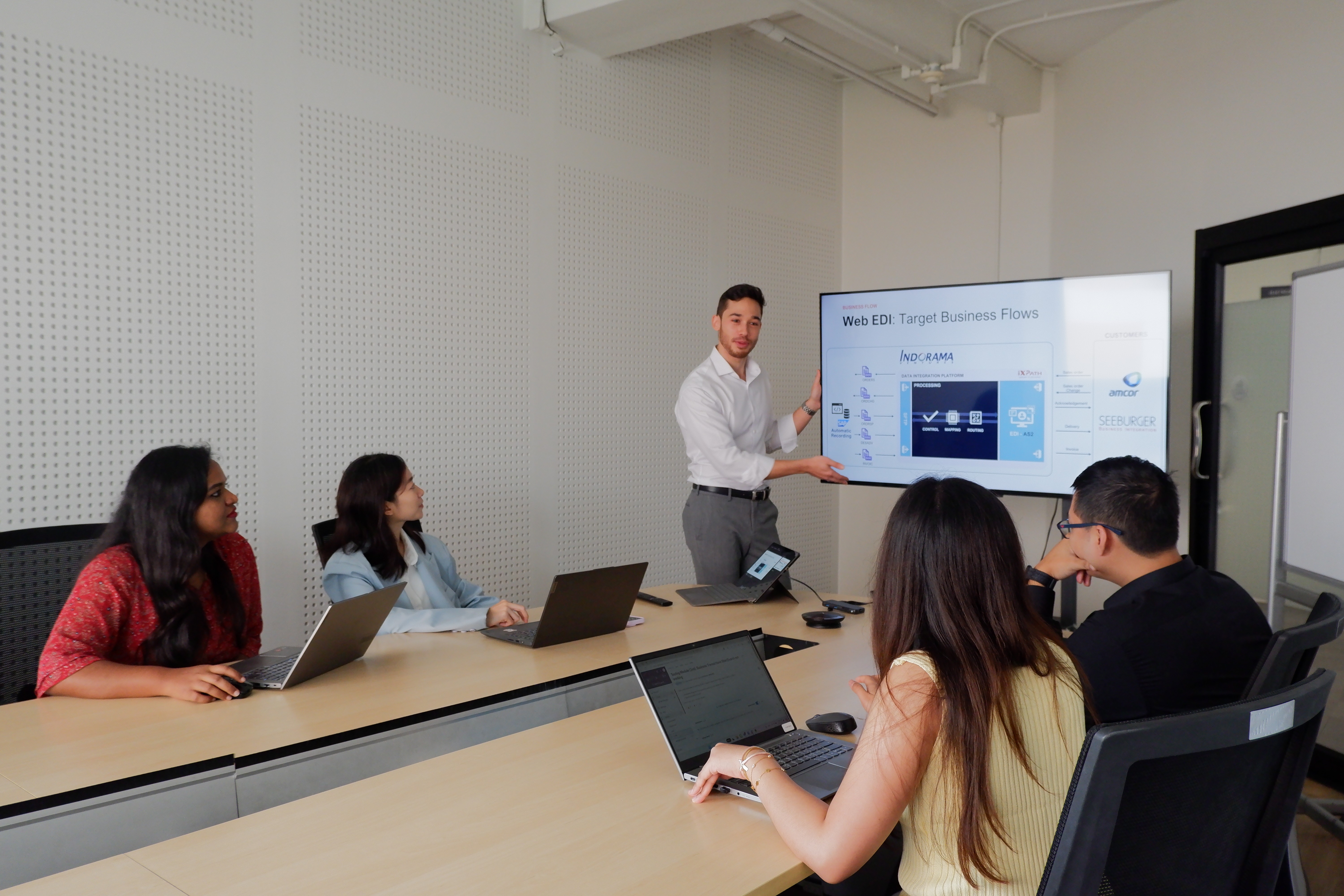 a man giving a presentation to a group of people