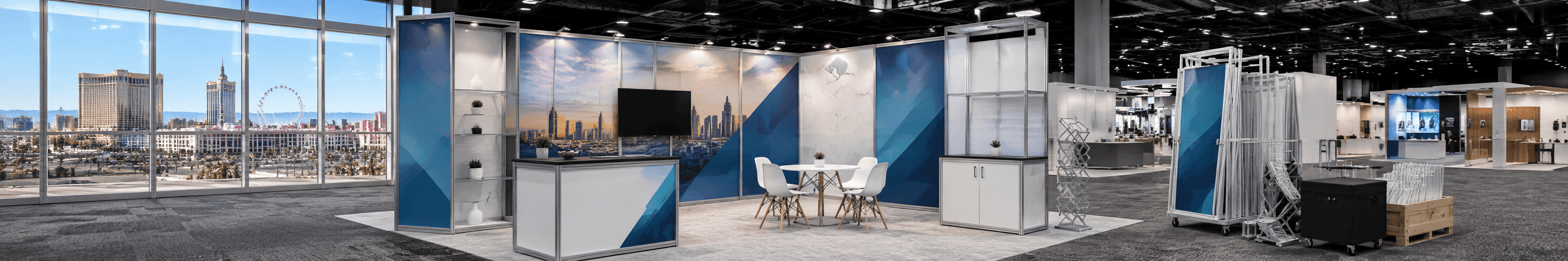 Modular exhibit systems for Las Vegas booth planning with rental structure, reusable booth components, branded graphics, meeting area, and show-site installation setup