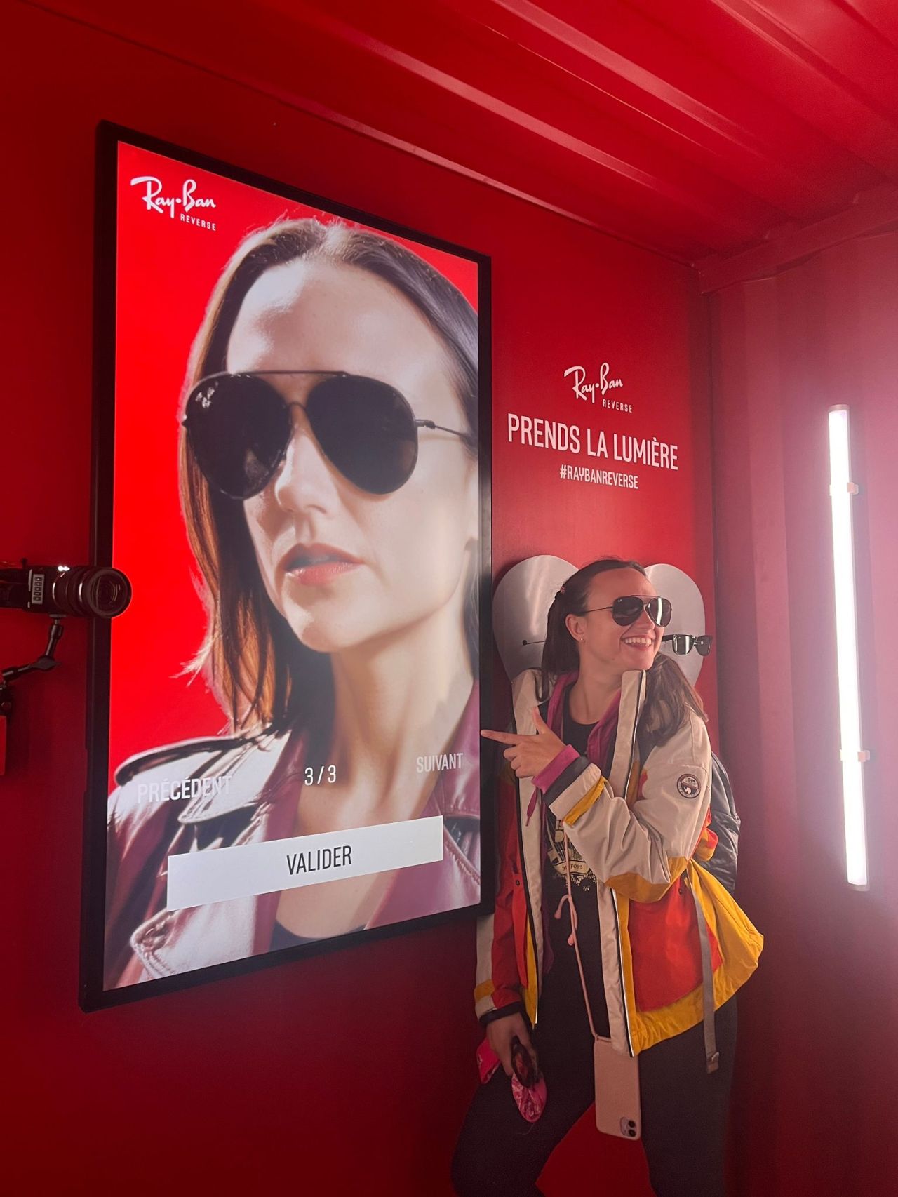 Inside Ray-Ban booth at Les Eurockéennes music festival with one user posing in front of her AI-Powered UGC.