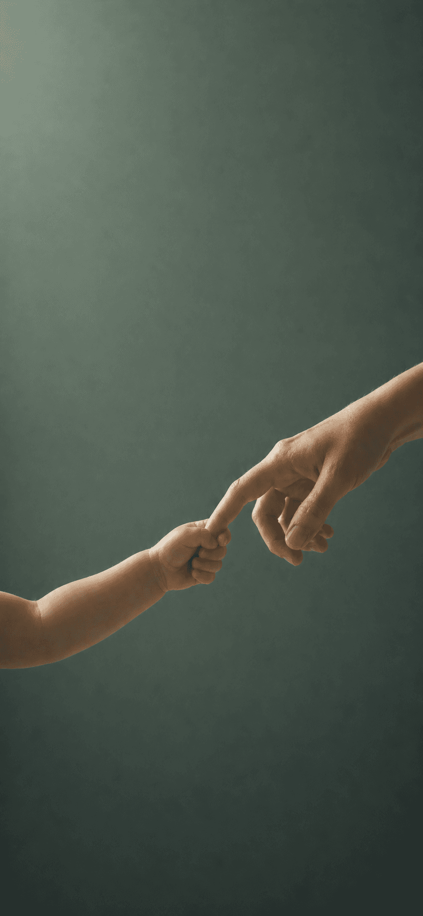 Boy sat on desk with arms folded