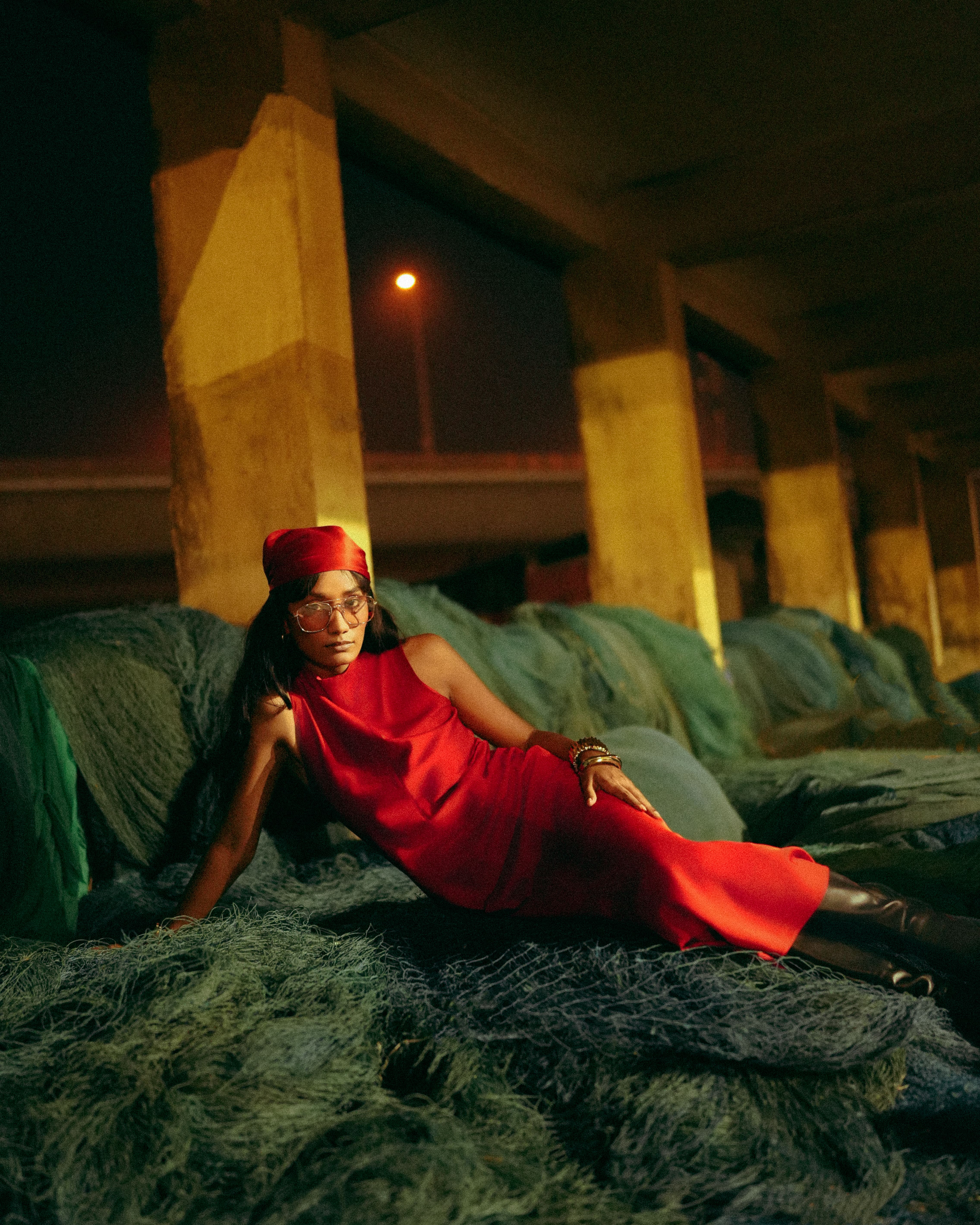 Group of friends smiling on a lively city street at night
