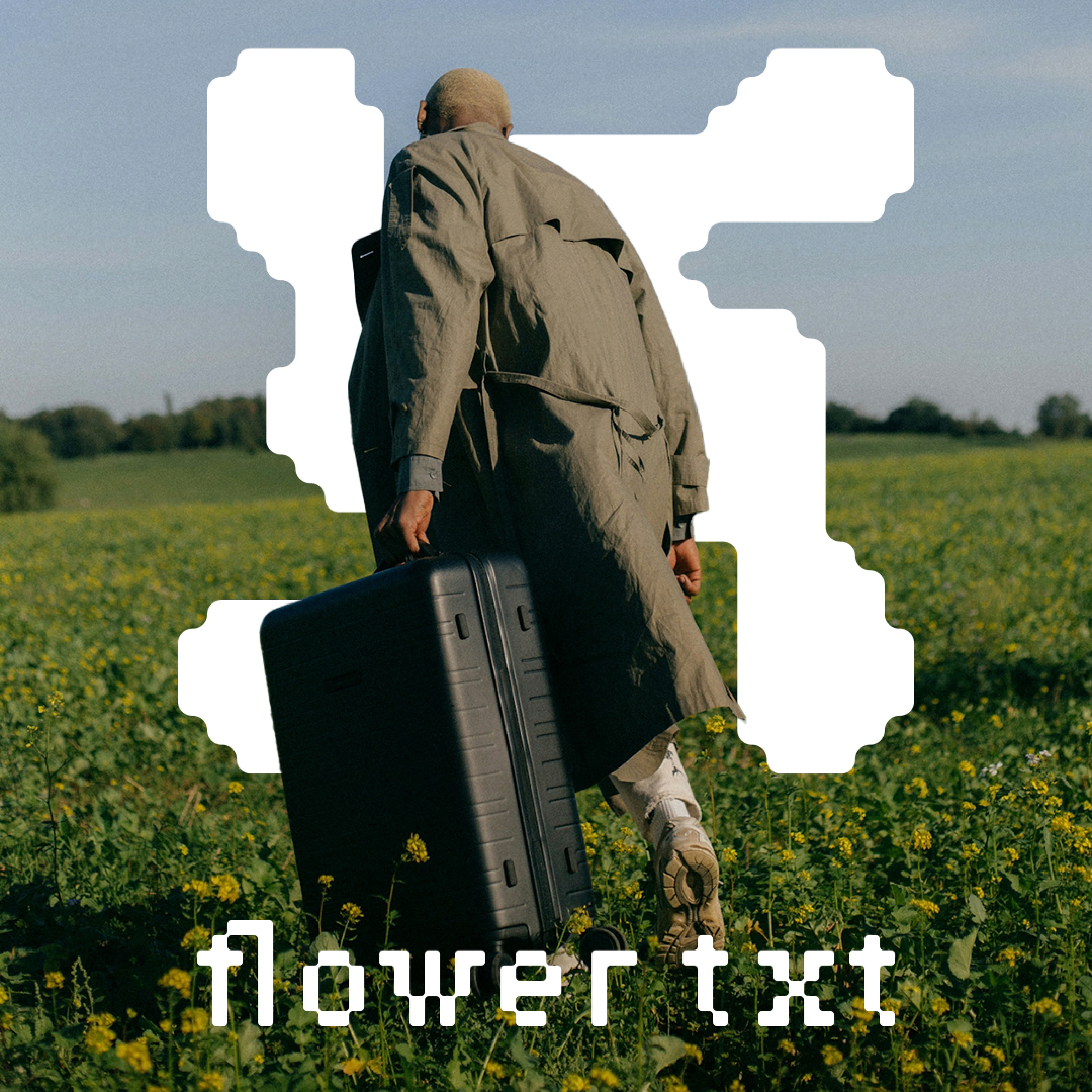 man wearing grey t-shirt standing in front of man sitting on chair