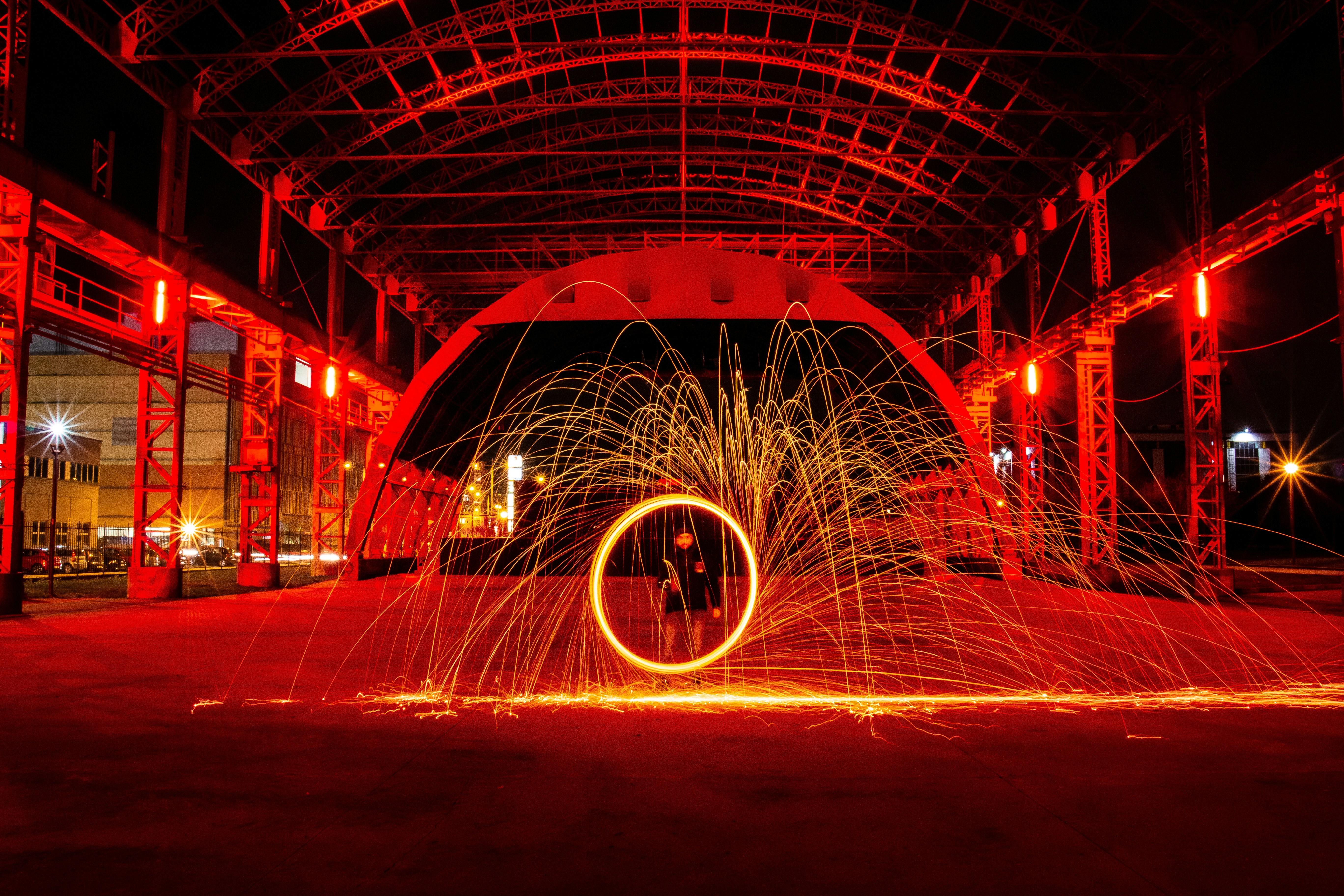 time lapse photography of person standing in front of fire display