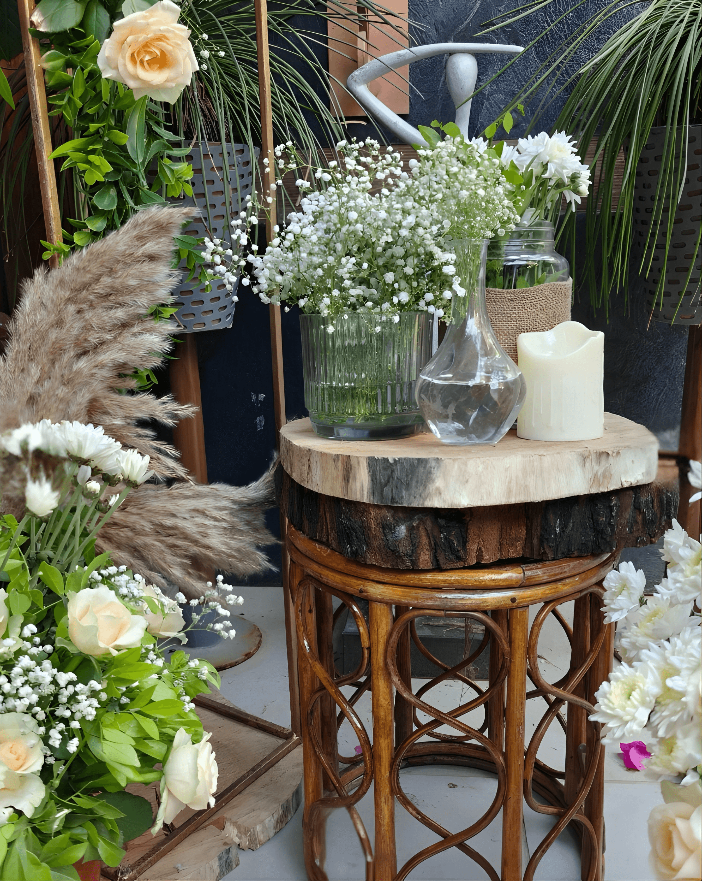 A couple in wedding attire walks hand in hand across a sunlit field.