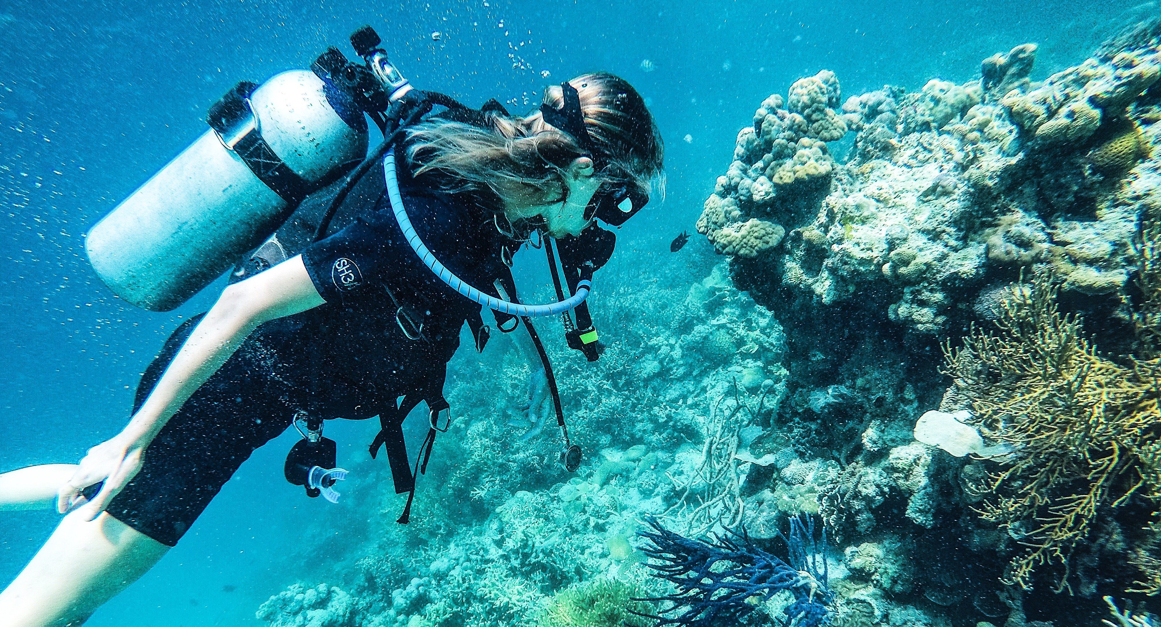 people walking near white concrete building during daytime
