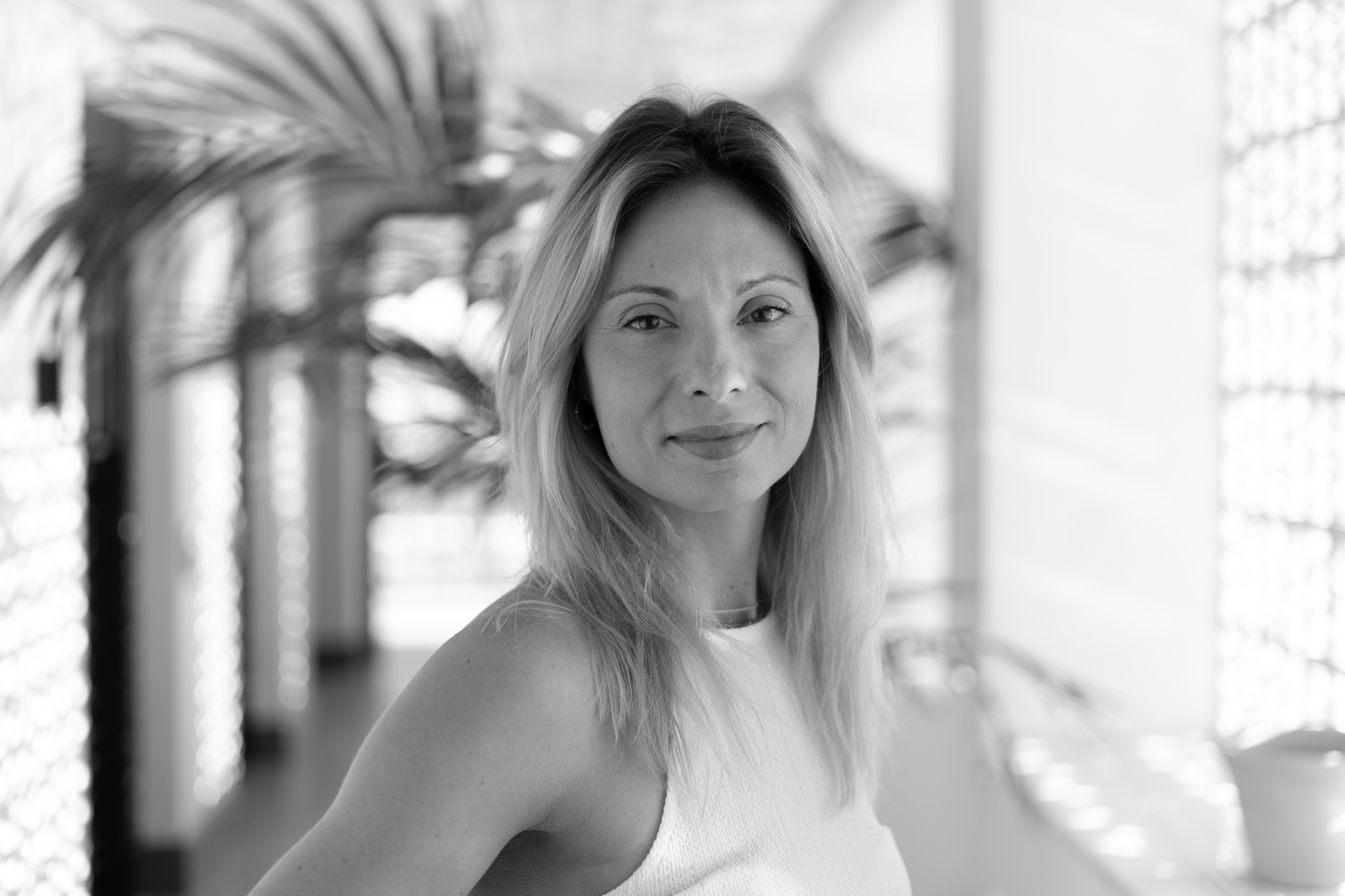 A confident consultant looking at the camera with a supportive look