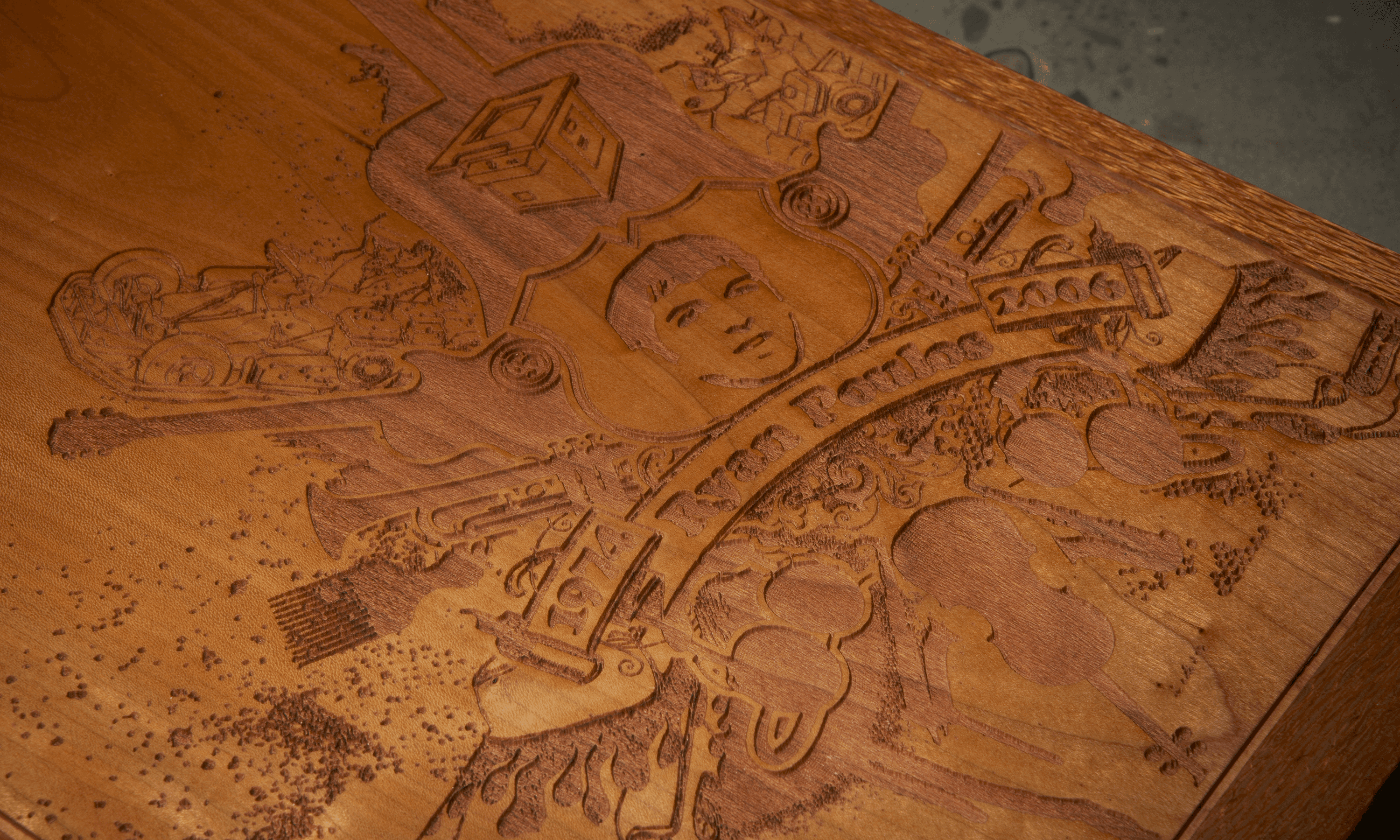 cropped detail of custom, lasered wooden closed shoe box