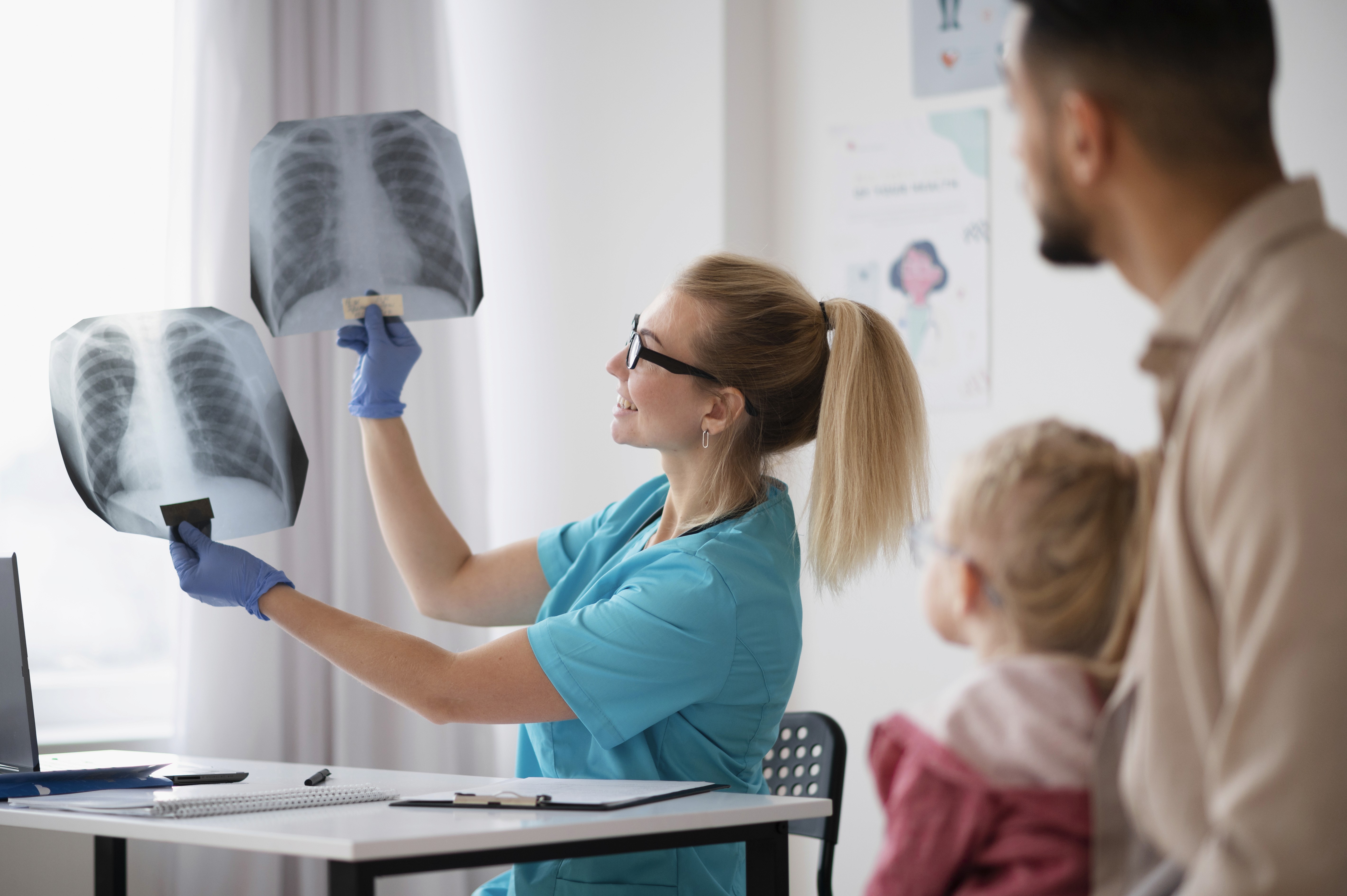 A doctor examining the chest X-rays.