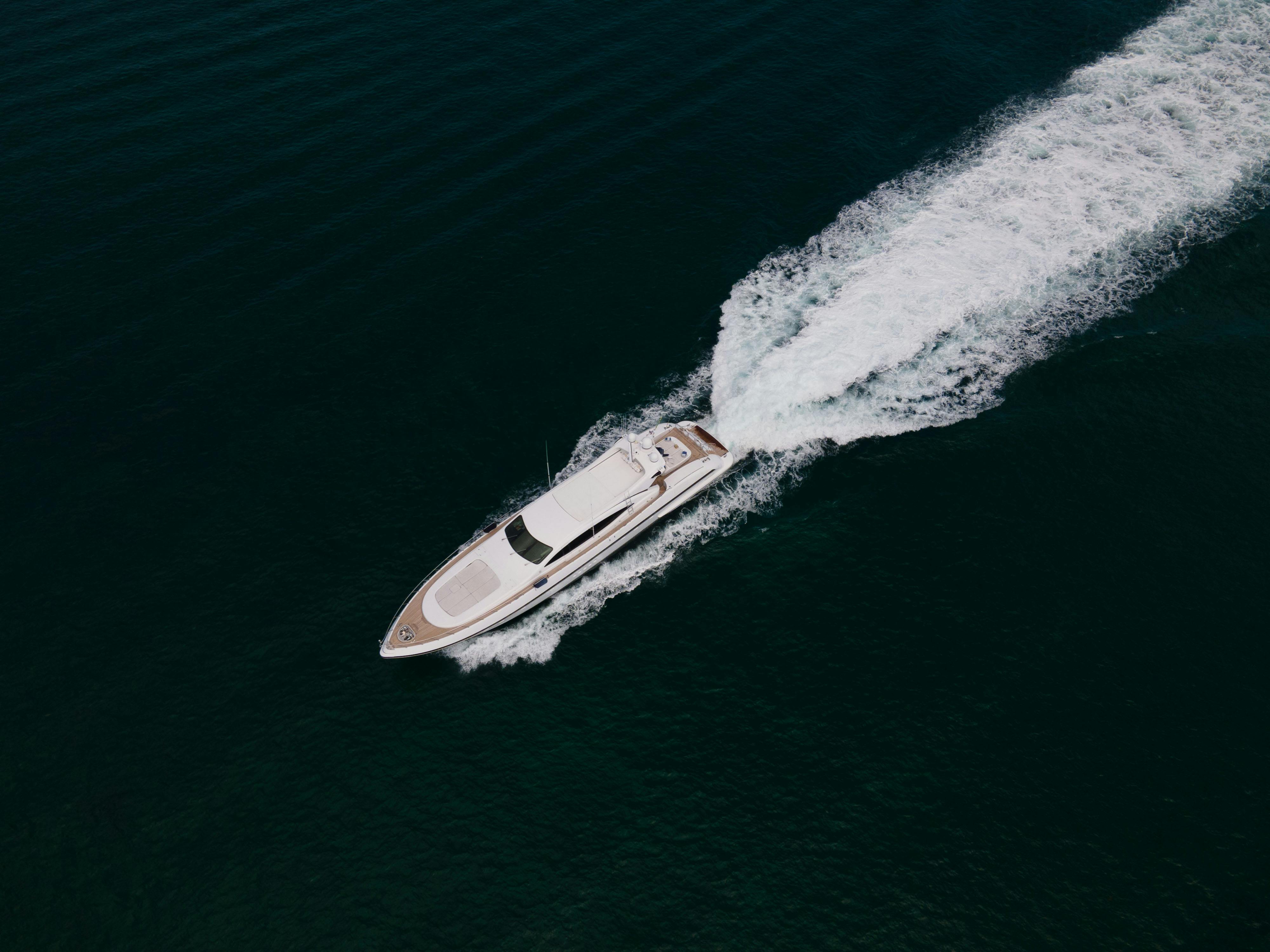 beautiful-aerial-view-of-a-yacht-leaving-a-trail-as-it-moves-swiftly-across-the- - david-rado (pexels)