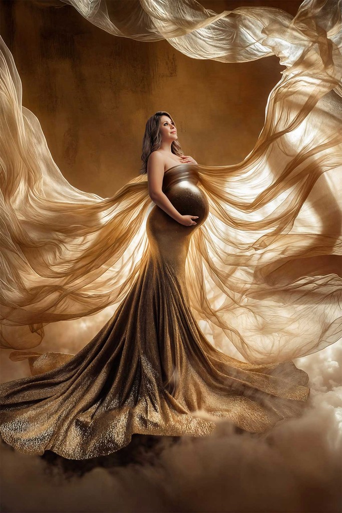 Maternity photography with designer dress and warm neutral tones.