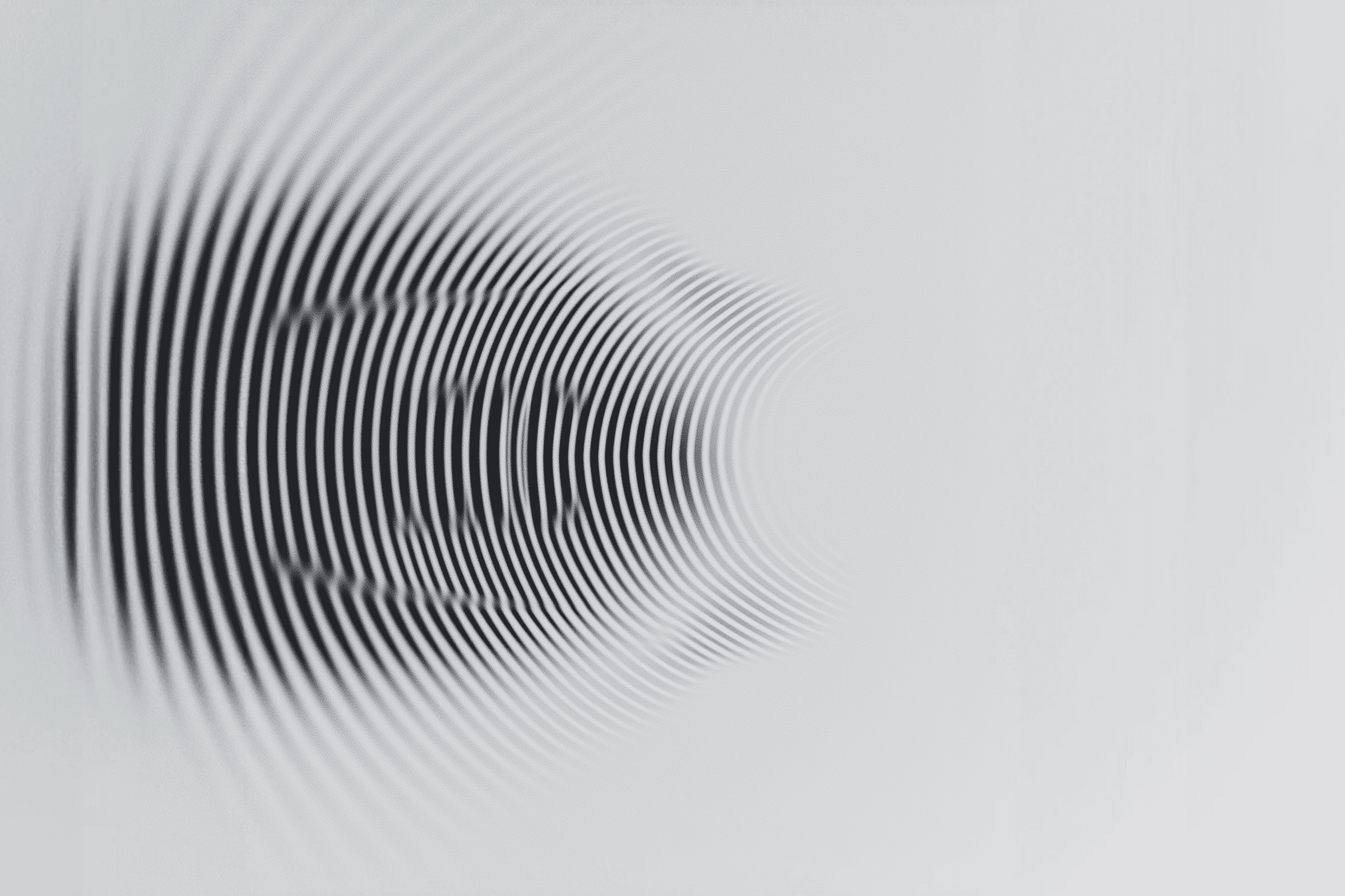 Abstract black and white wavy lines create a dynamic optical illusion, offering a sense of movement and depth.