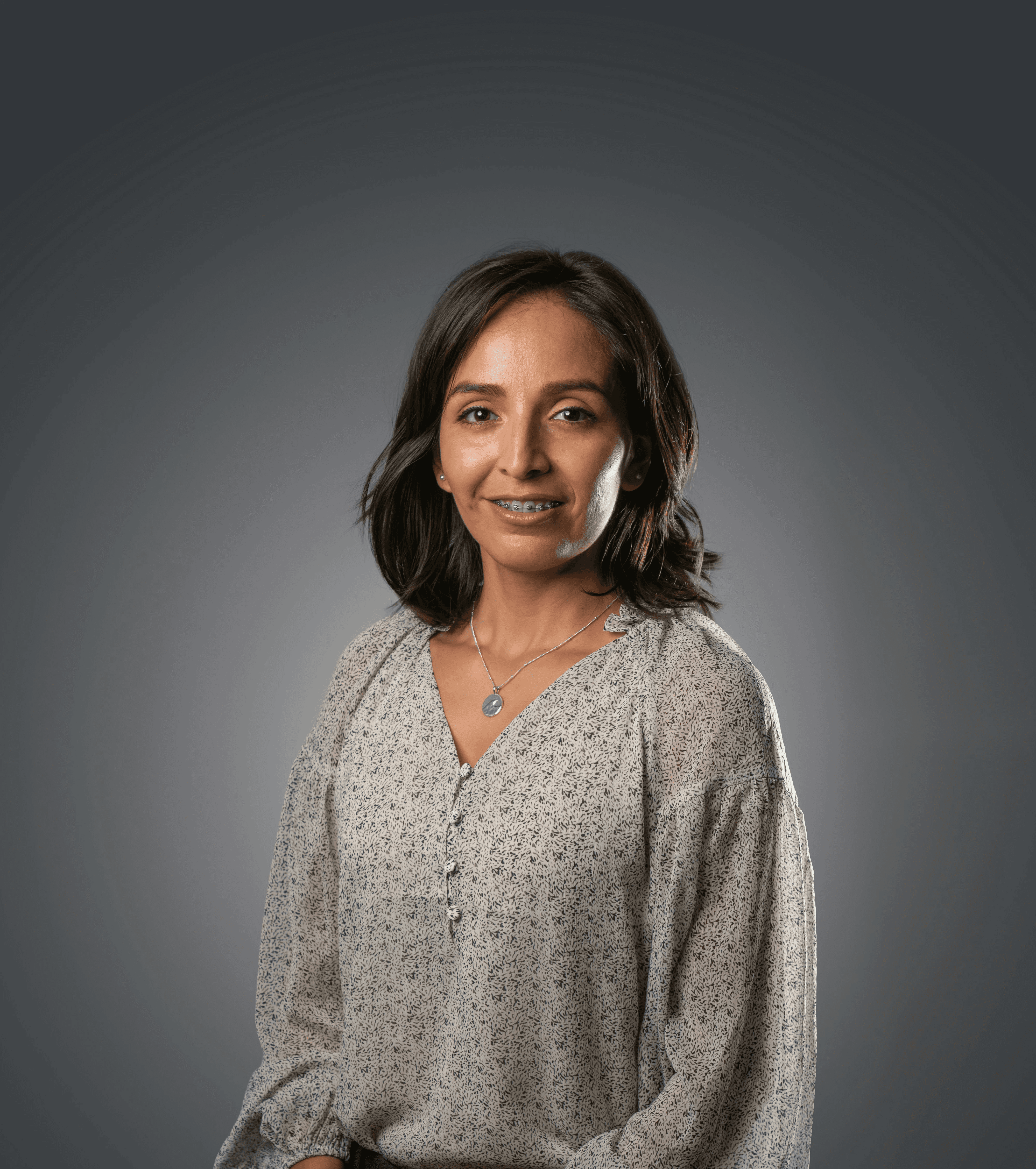 a person with a grey sweater