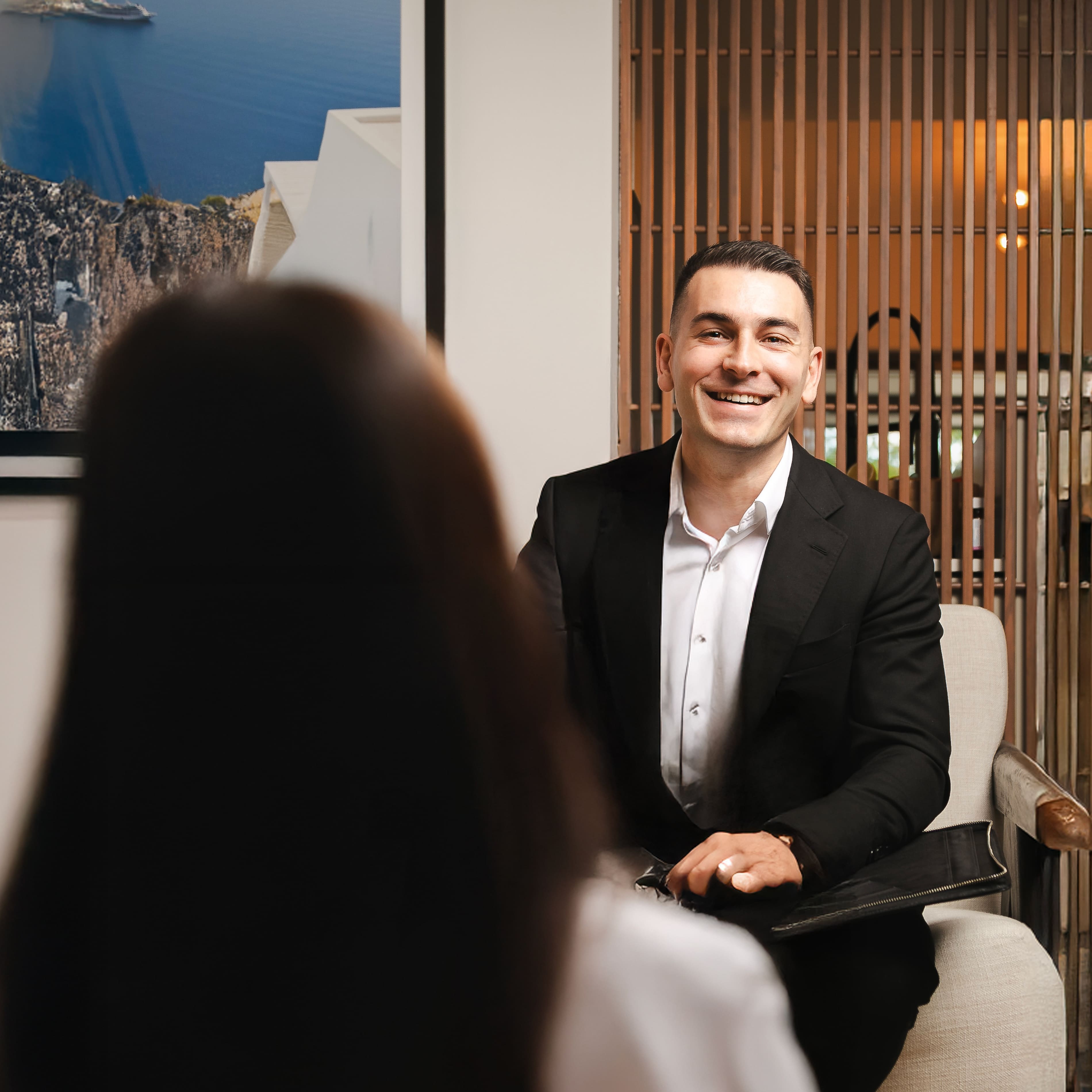 Mortgage broker Dimitri Giannopoulos speaking to happy client