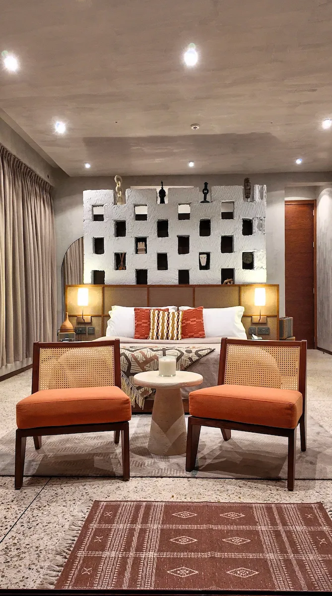 wide shot of bed and chairs