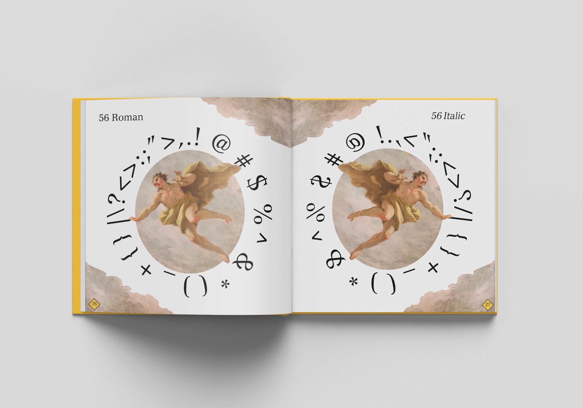 book open on a white table showing illustrations and symbols