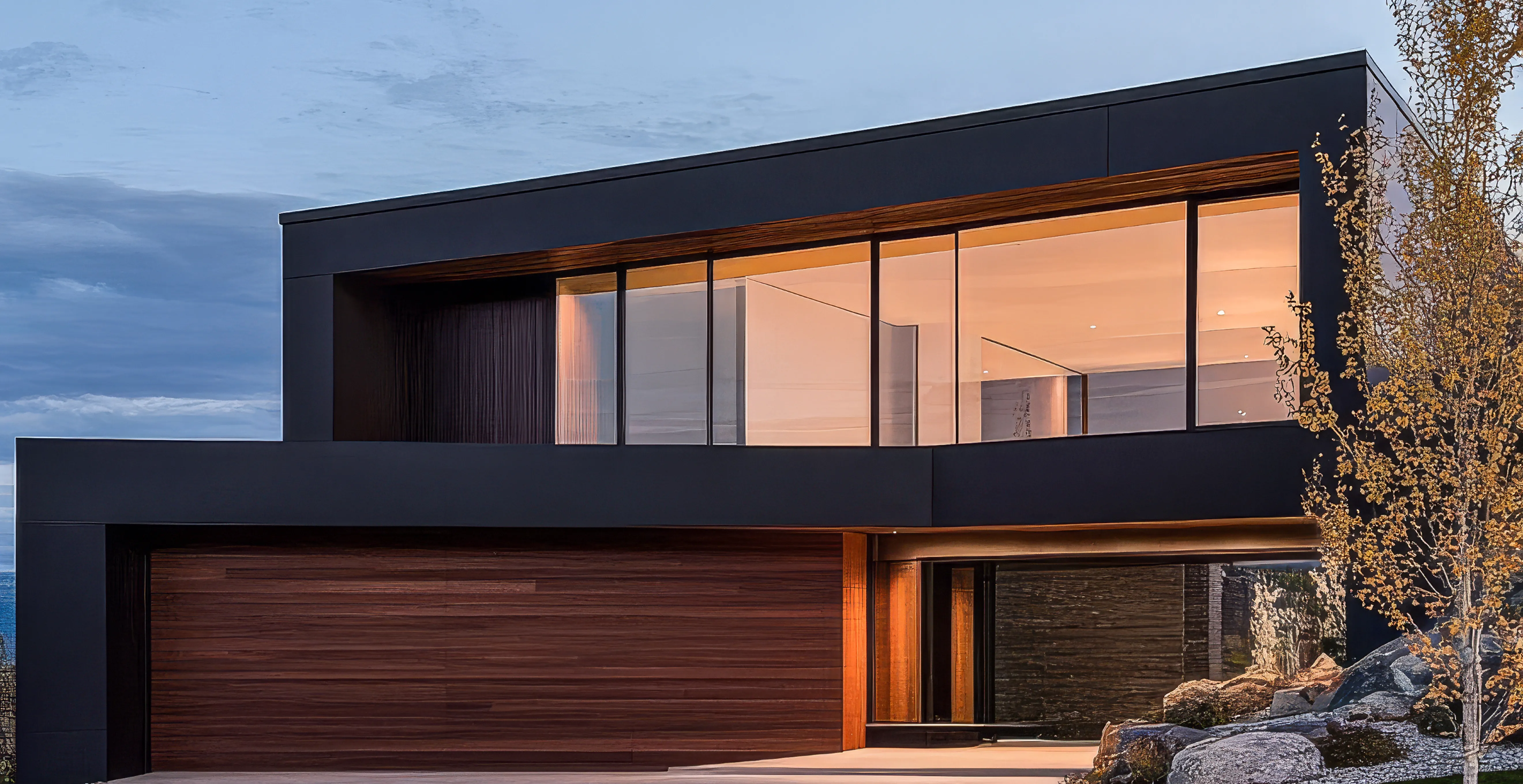 Minimalist modern home with black facade, large glass windows, and a wood-paneled garage at twilight.