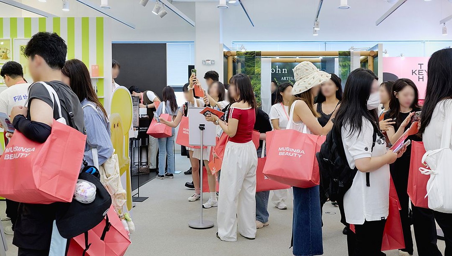 Visitors browsing brand booths inside Musinsa's Beauty Festa popup in Seongsu, Seoul.