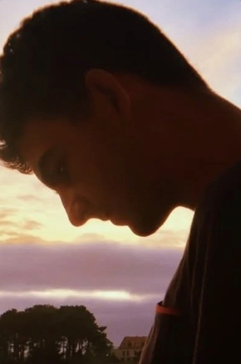 Woman wears a blue coat in a blue environment.