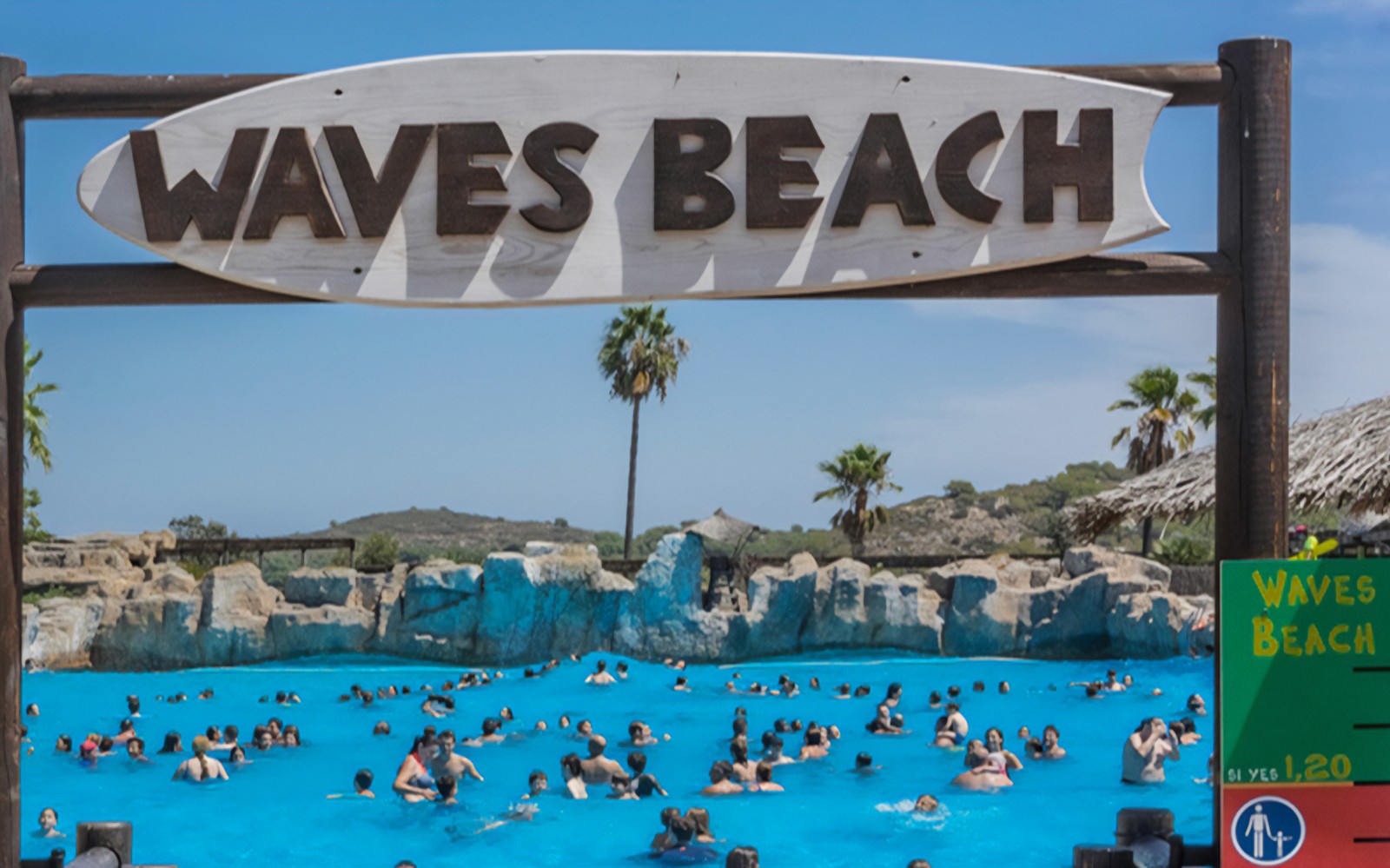 Visitors enjoying the wave pool at Waves Beach, Aquopolis Cullera.