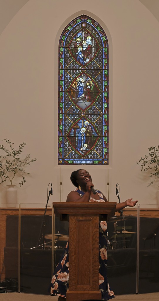Sister Ebone leading praise and worship at New Beginnings City Church