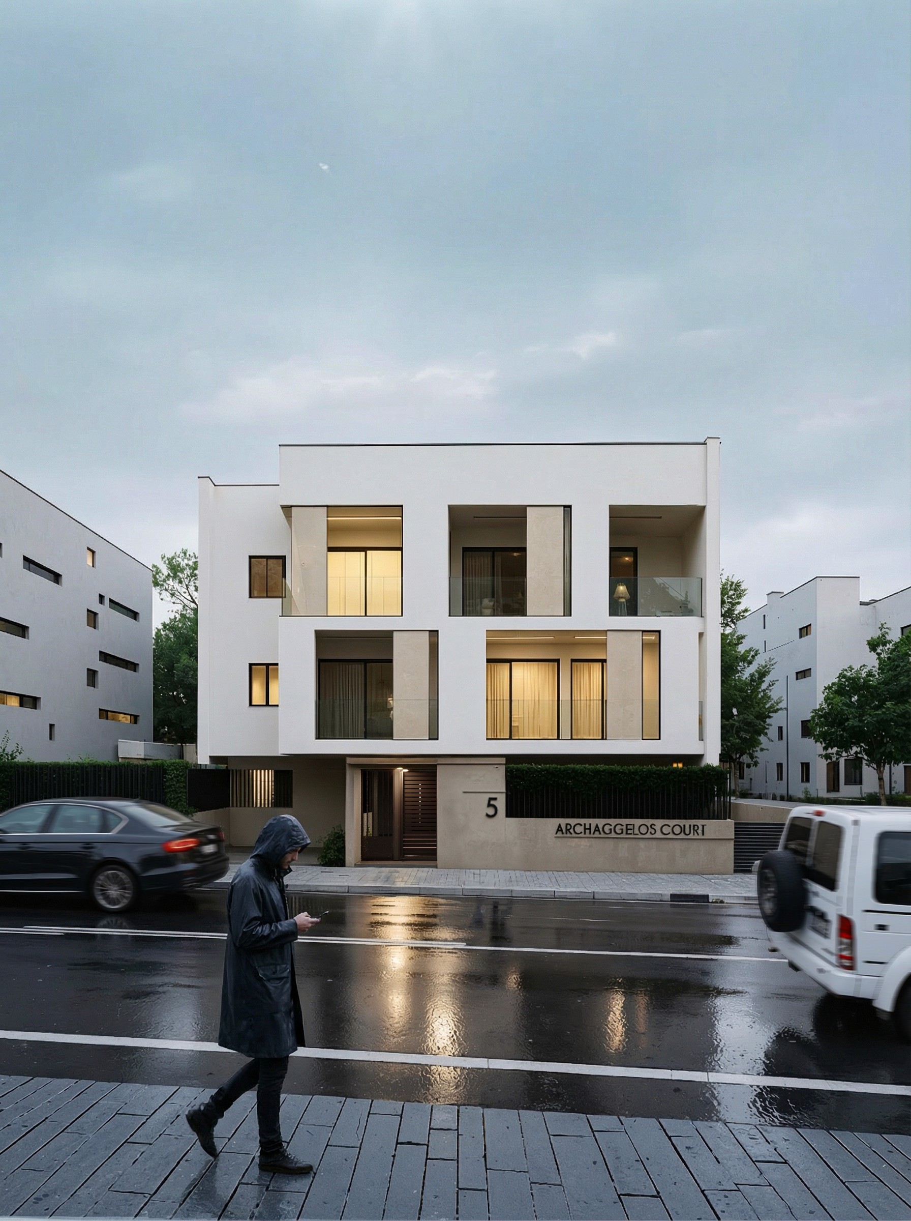 Close-up of a dark green leaf showing its textured surface and central vein against a muted background.